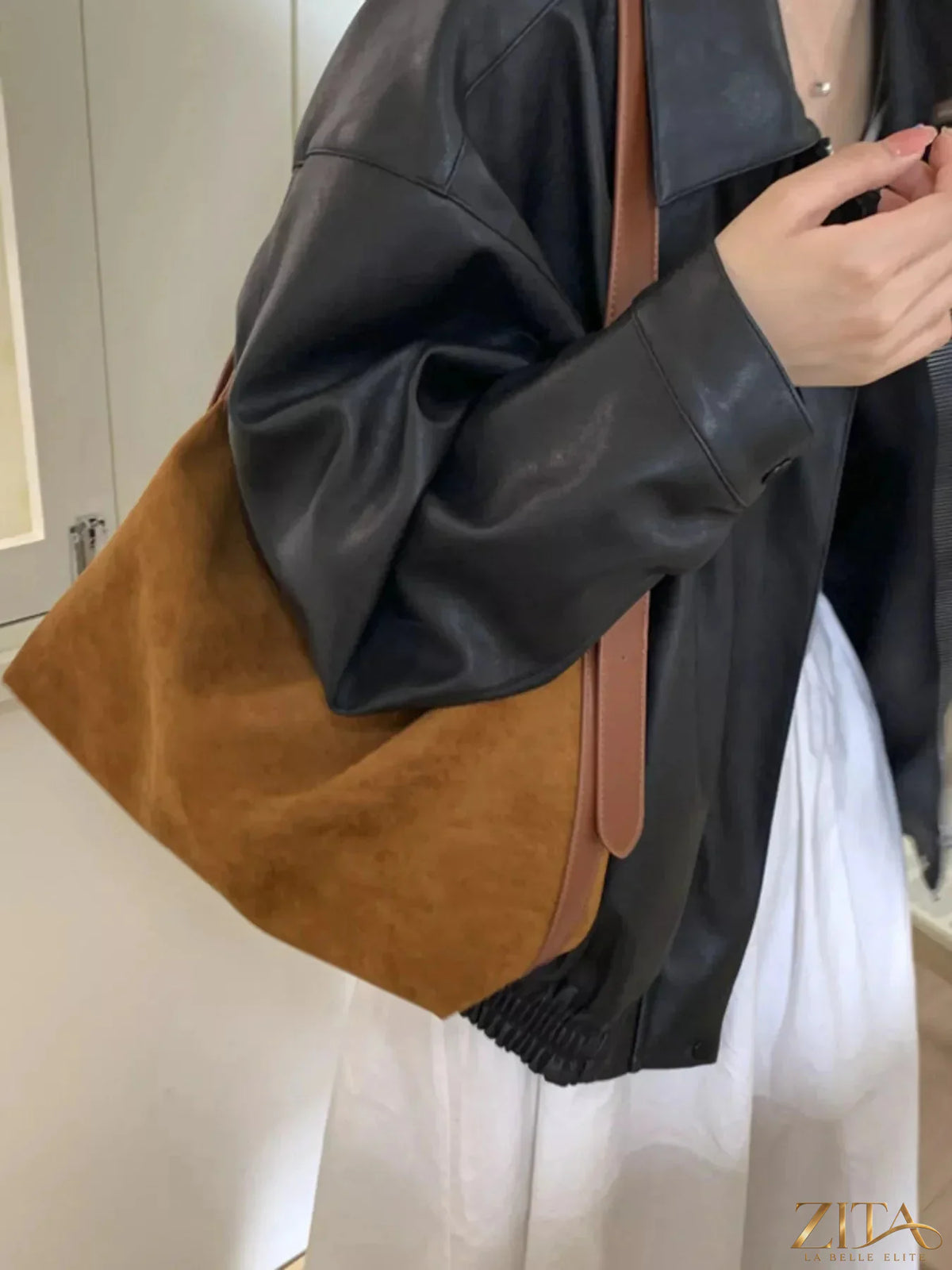 Zita La Belle Elite solid color suede hobo crossbody bag with a relaxed design and adjustable strap.