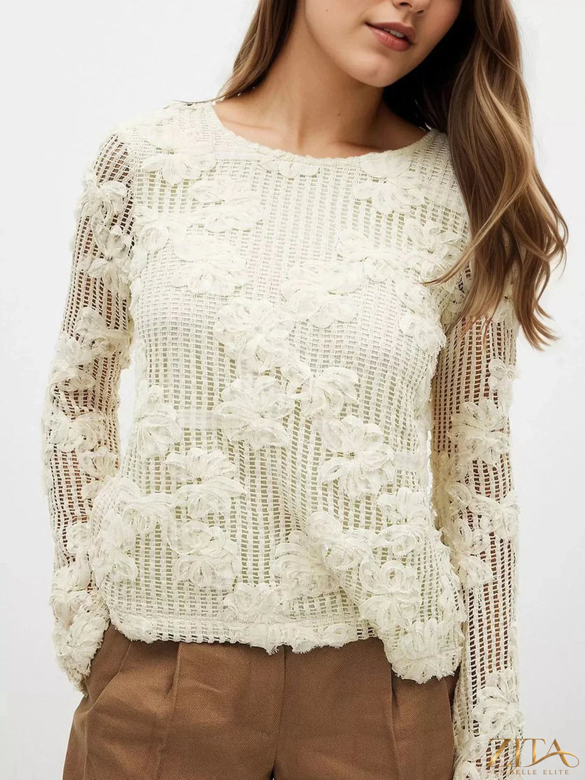 Zita La Belle Elite openwork tied back long sleeve blouse with intricate lace details and a relaxed fit.