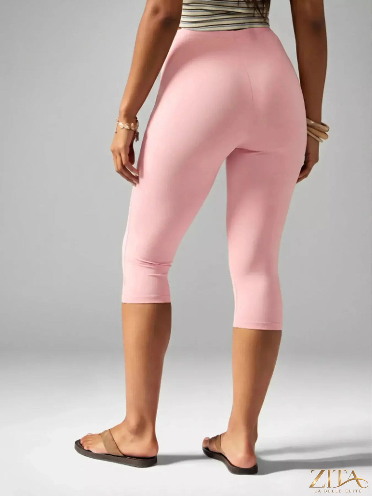 Zita La Belle Elite high-waisted active capri leggings displayed on a hanger with a black and white background.