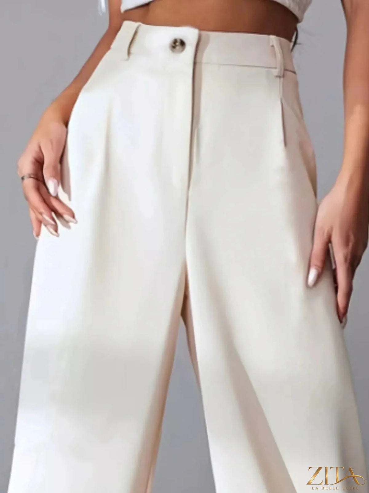 Zita La Belle Elite wide leg pleated pants in a flowing fabric, featuring a high waist and relaxed fit.