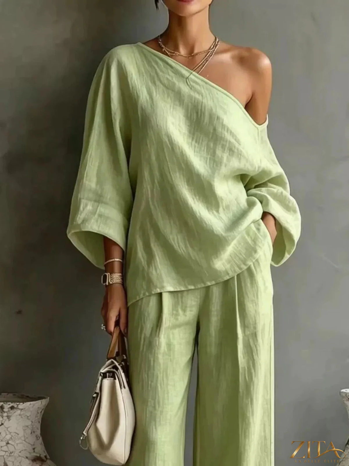 Zita La Belle Elite one shoulder top and wide-leg pants set, stylish fashion ensemble, featuring a modern one-shoulder top and flowy pants.