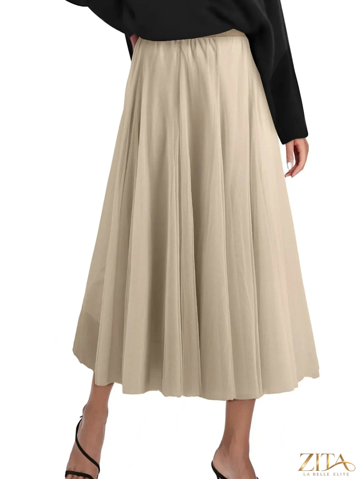 High-waisted midi skirt from Trendsi featuring a flowy design and neutral color, showcased on a model.