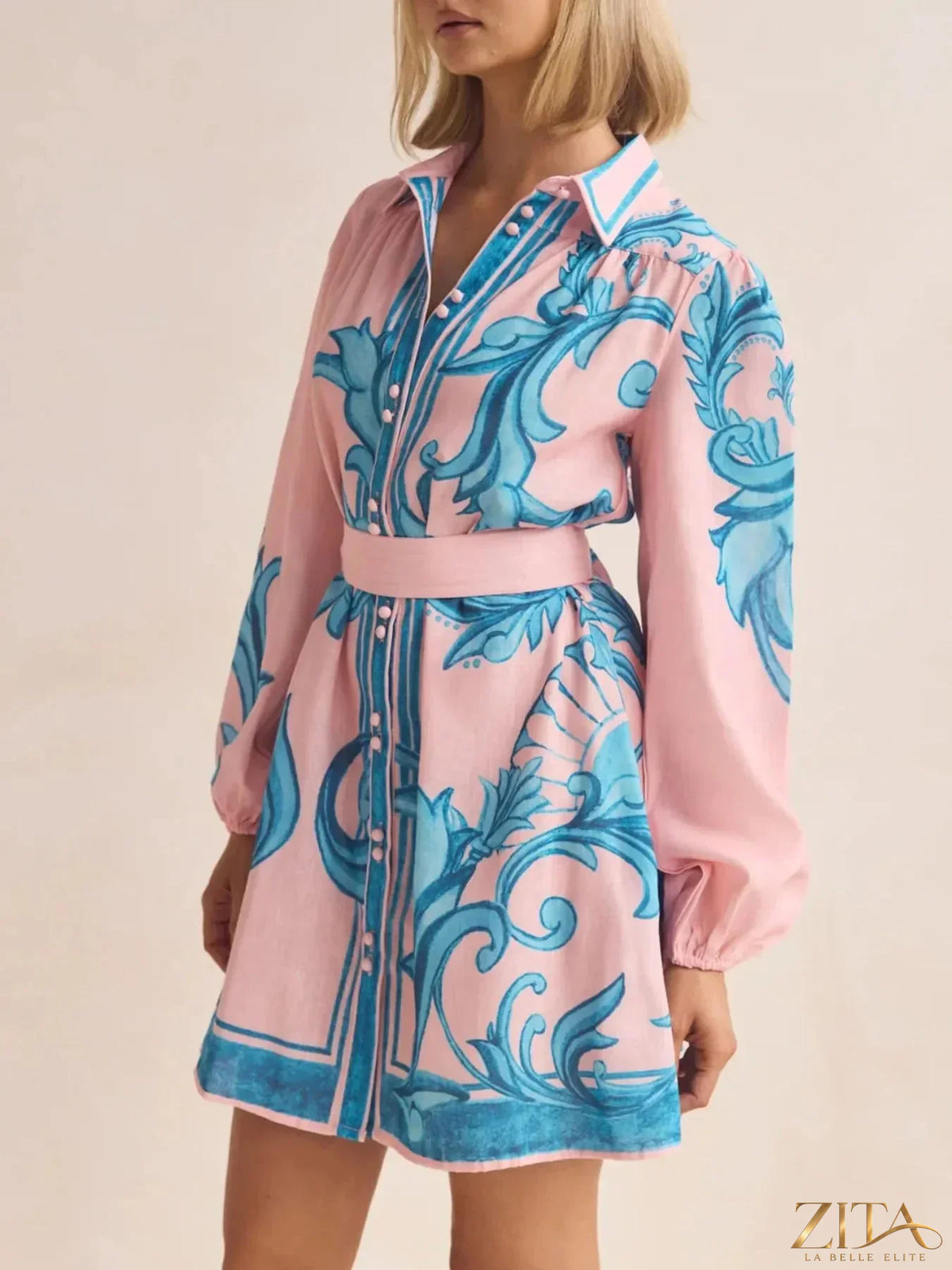 Printed long sleeve shirt dress by Trendsi featuring a stylish, casual design with a button-up front and relaxed fit.