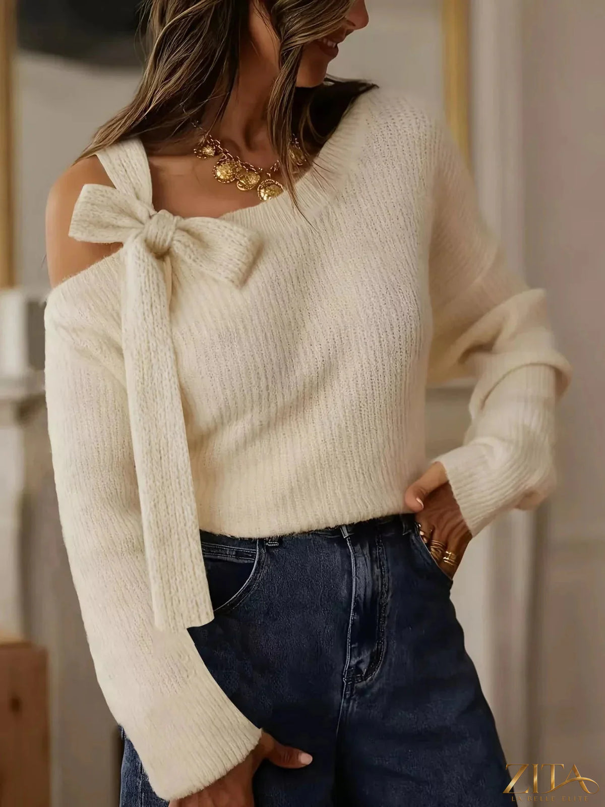Zita La Belle Elite bow-accent one-shoulder sweater in soft knit fabric, featuring a stylish bow detail on the shoulder.