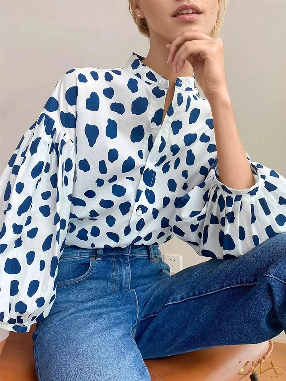 Printed puff sleeve button-down shirt by Zita La Belle Elite, featuring vibrant floral print and classic collar detail.