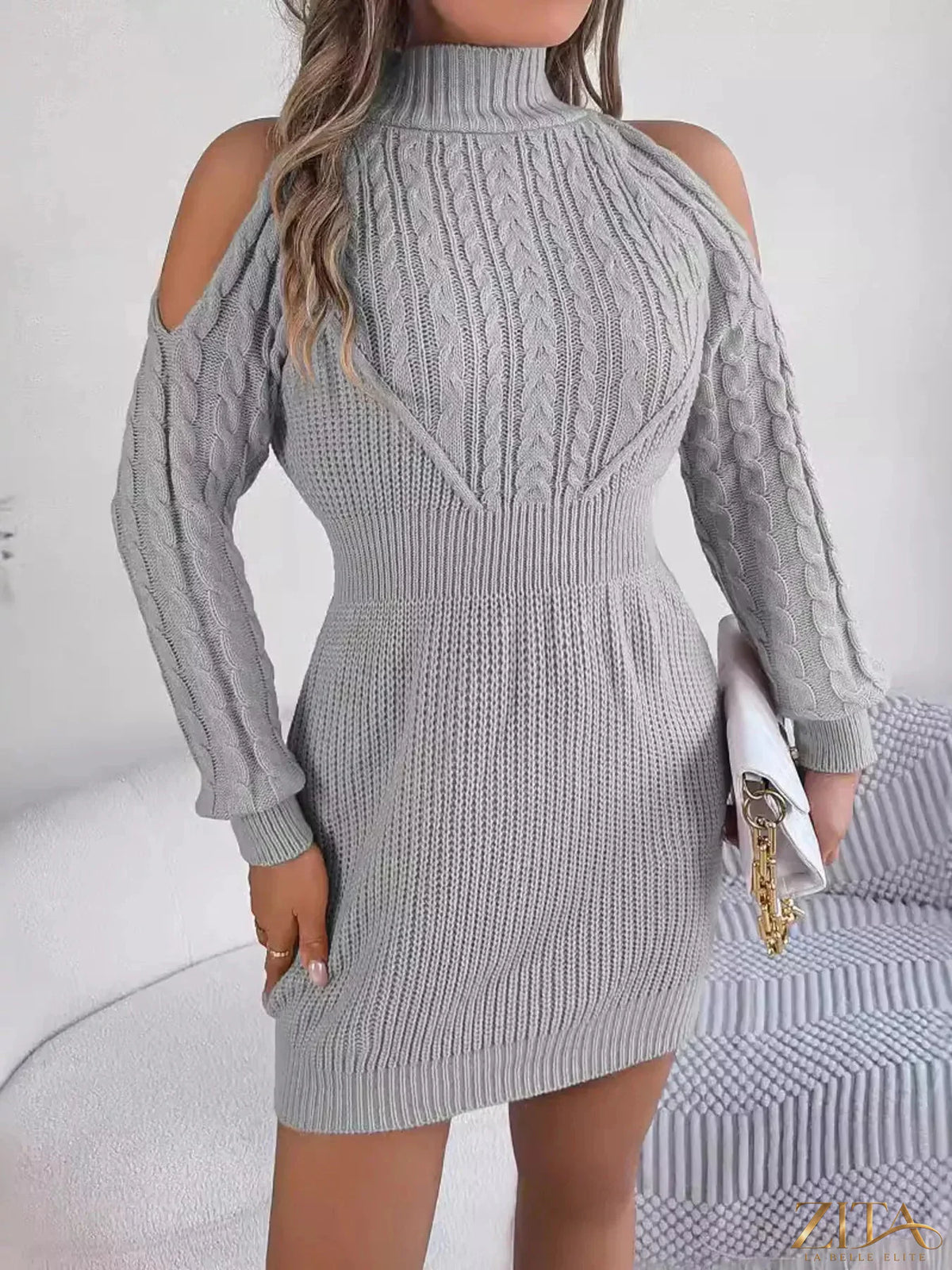 Cold shoulder cable knit turtleneck sweater dress by Trendsi, featuring a cozy knit fabric and stylish shoulder cutouts.
