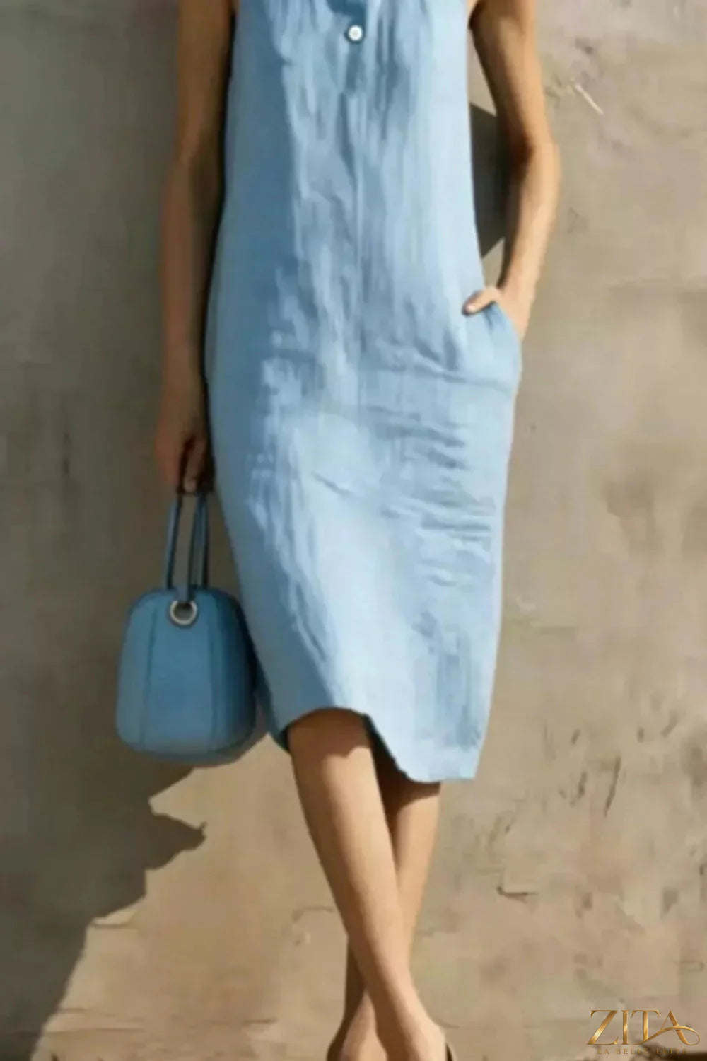 Zita La Belle Elite casual sleeveless midi dress with button details, flowing fabric and stylish design for everyday wear.