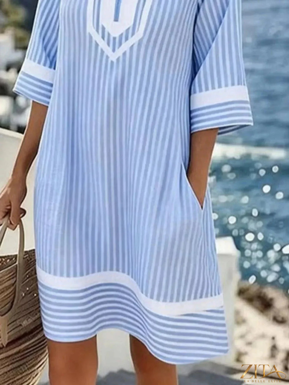 Plus size striped V-neck casual dress by Zita La Belle Elite, featuring a full-length design with bold horizontal stripes.