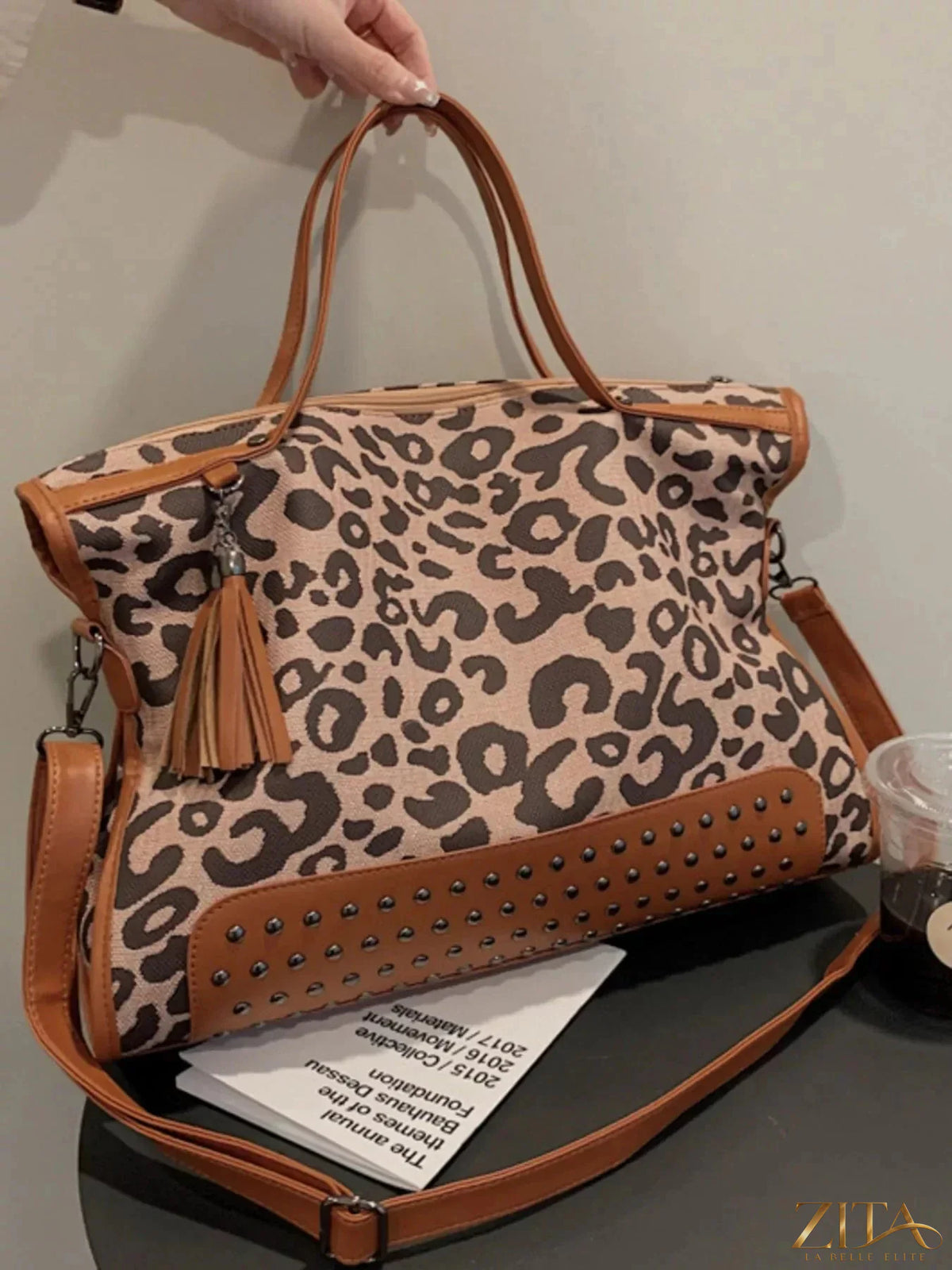 Leopard print studded tote bag by Zita La Belle Elite with leather handles and gold-tone hardware, stylish and spacious for daily use.