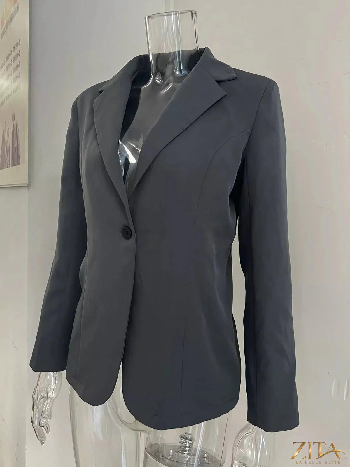 Slim-fit casual blazer with single button closure, Trendsi brand, tailored look, lightweight fabric, and classic collar style.