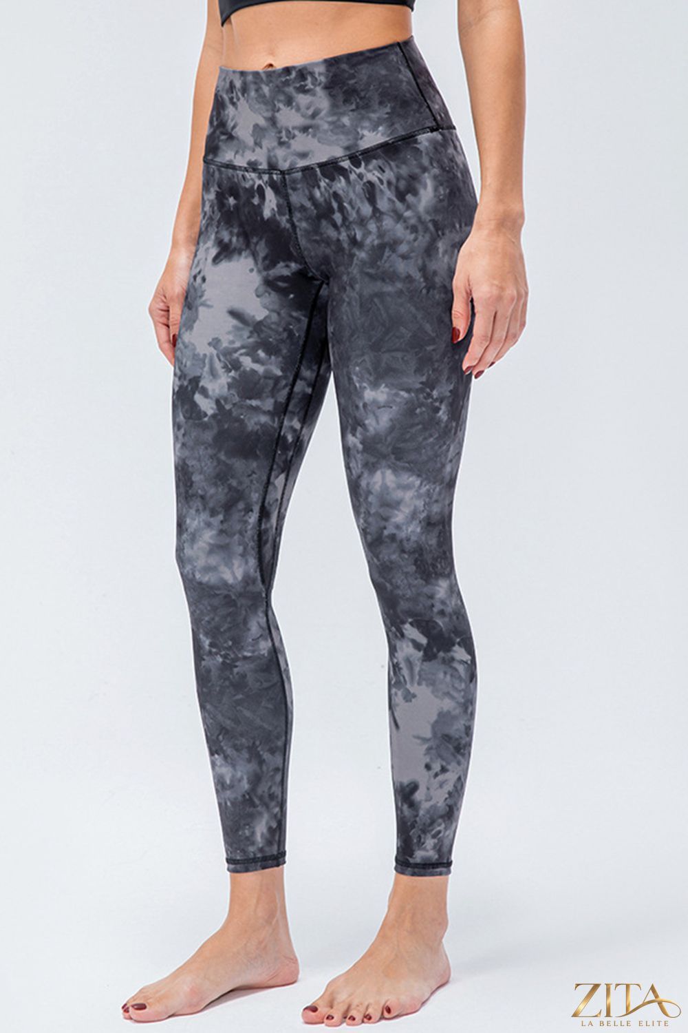 Slim fit active leggings with wide waistband from Trendsi, featuring a sleek design suitable for workout and casual wear.