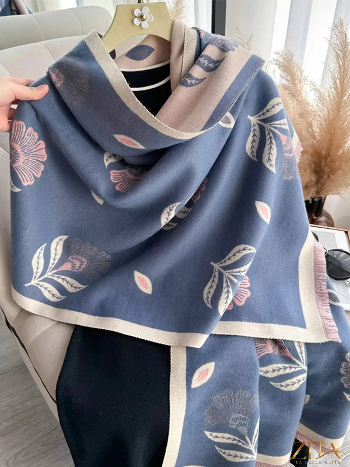 Printed raw hem shawl by Zita La Belle Elite, showcasing a stylish pattern and fringed raw edges on soft fabric.