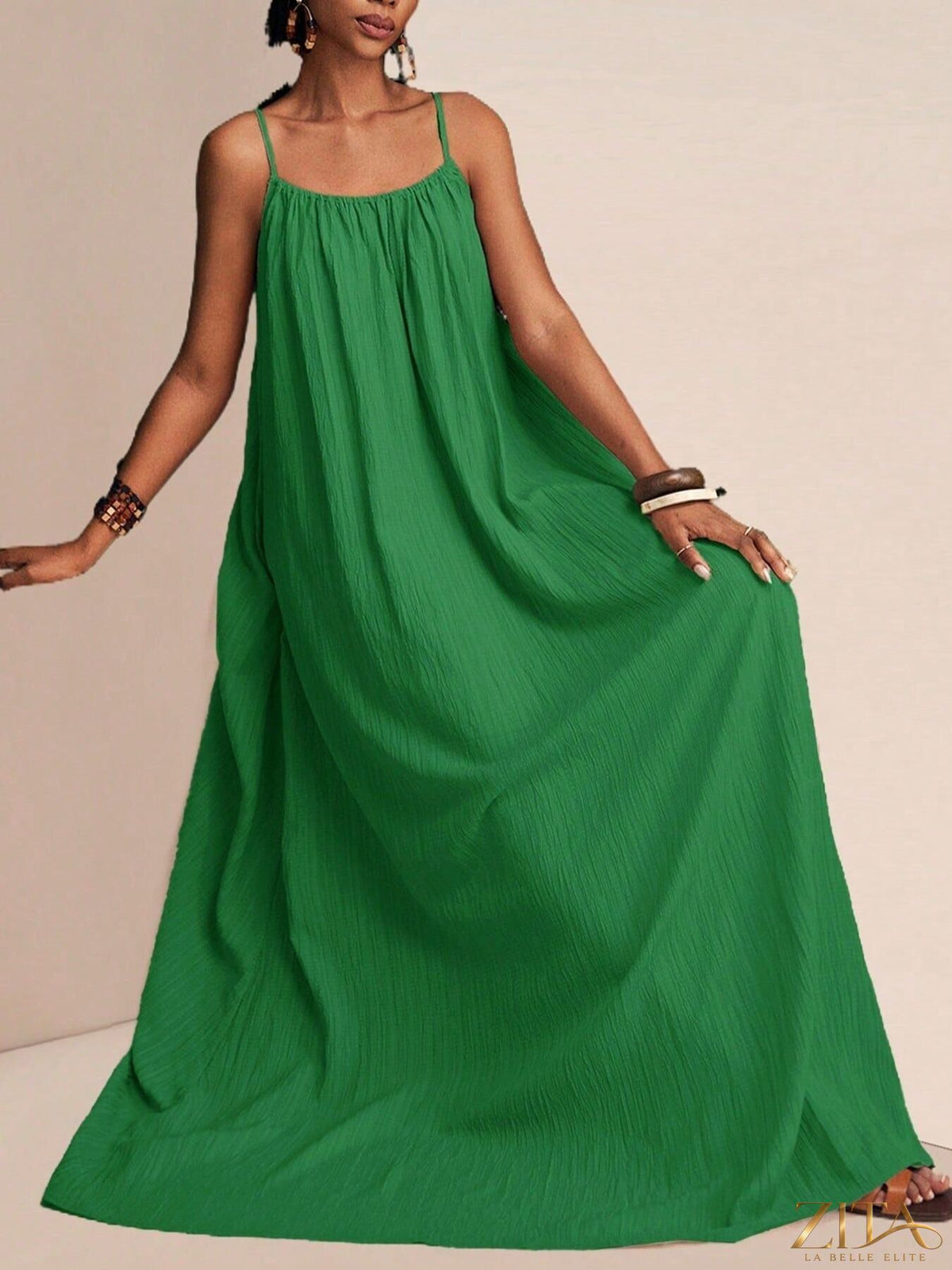 Flowy spaghetti strap maxi dress by Zita La Belle Elite, featuring lightweight fabric and a relaxed, elegant silhouette.