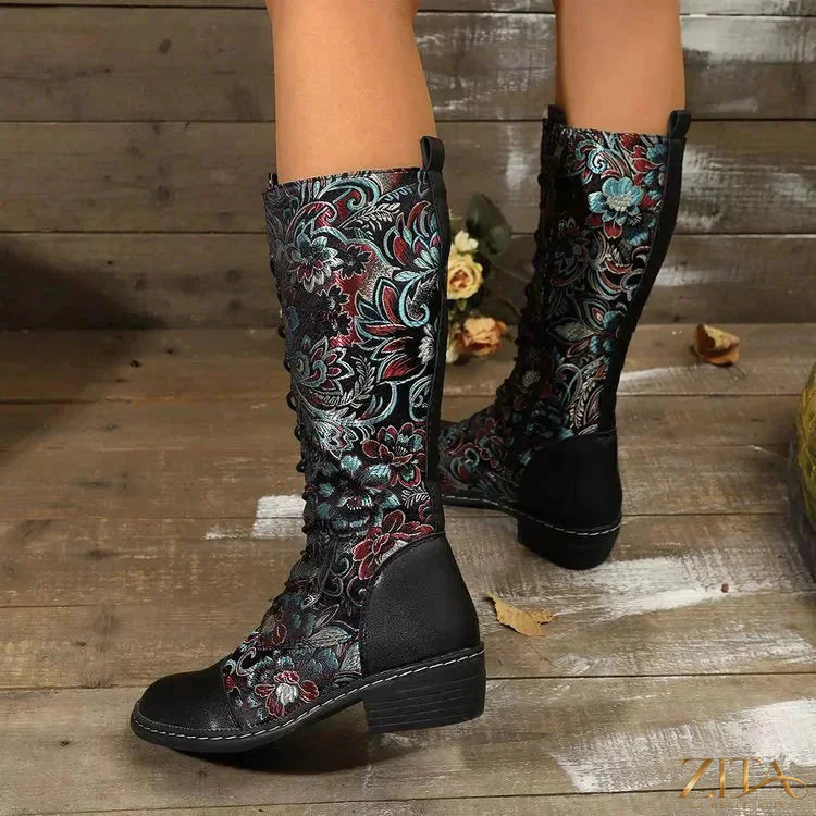 Zita La Belle Elite embroidered lace-up knee-high boots with intricate embroidery and sleek black leather design.