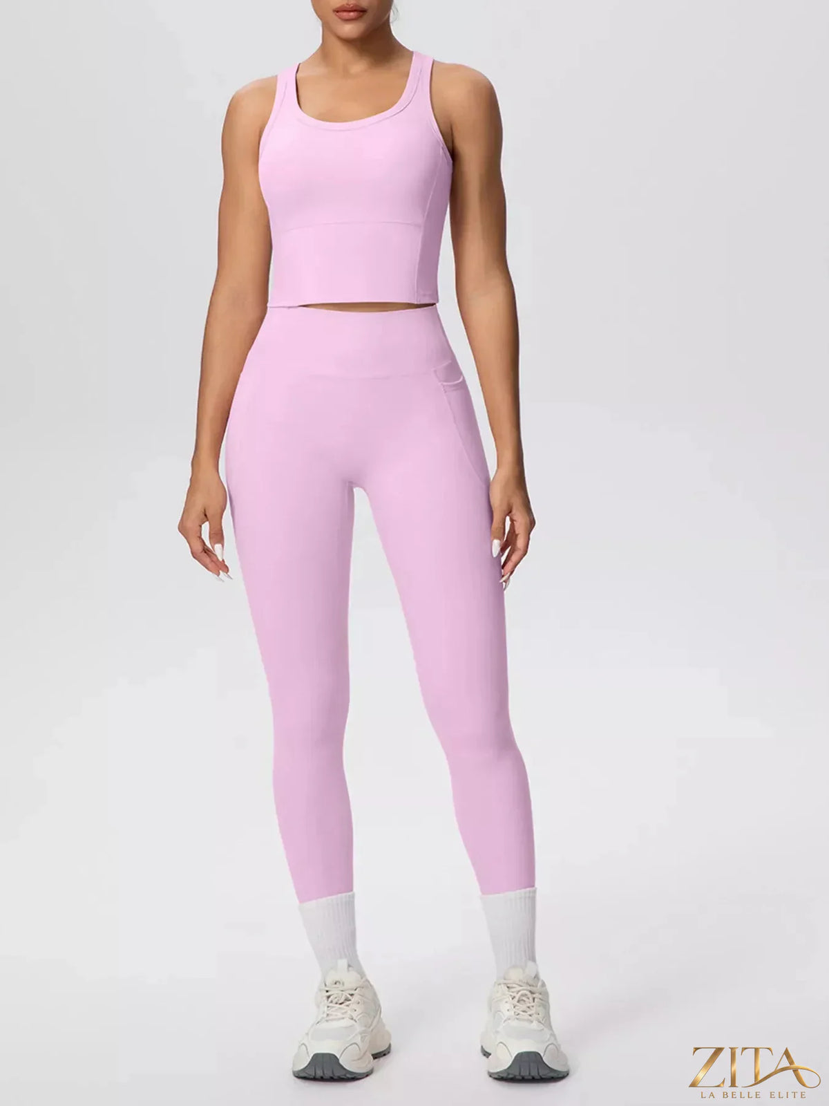 Zita La Belle Elite scoop neck tank top and high-waisted leggings active set on a model, showcasing stylish athleisure wear.