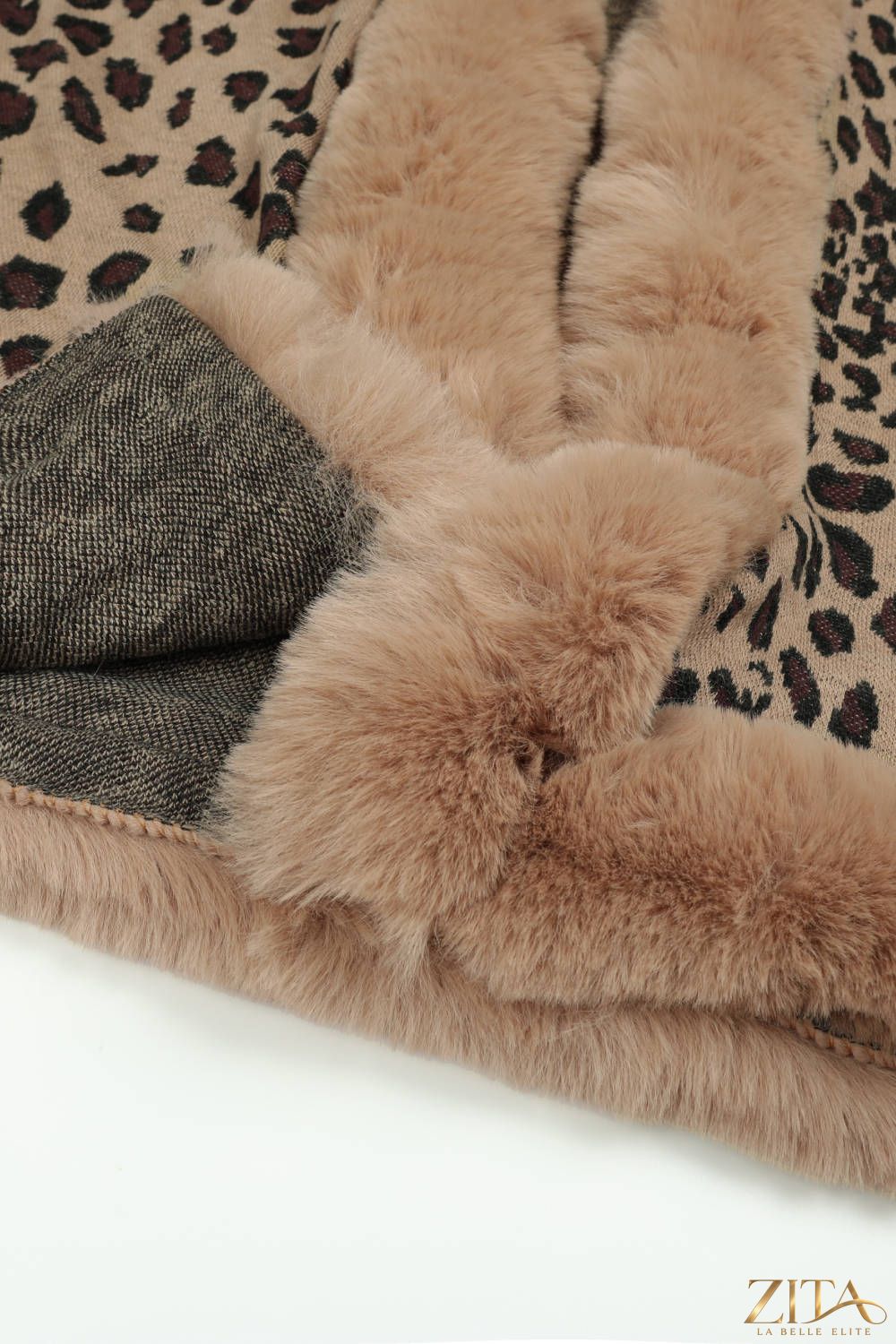 Leopard open front poncho from Trendsi, featuring a stylish animal print and relaxed fit, perfect for layering in cooler weather.