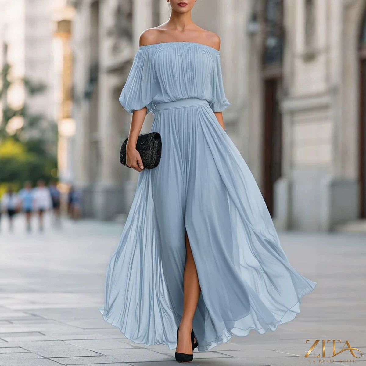 Elegant one-shoulder chiffon maxi dress with ruffle sleeve by Zita La Belle Elite, flowing fabric and sophisticated design.