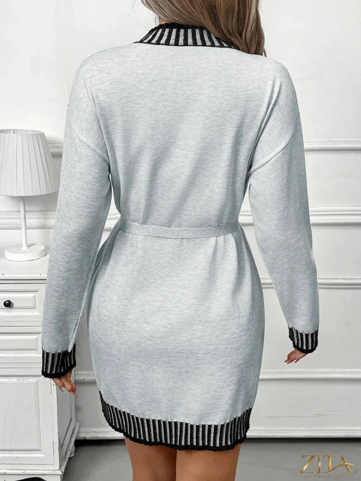 Zita La Belle Elite striped trim tie waist sweater dress with long sleeves and ribbed hem, styled on a model.