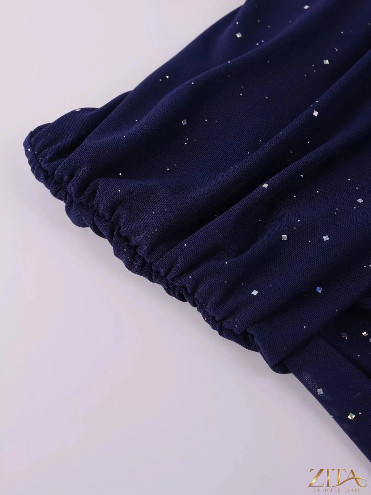 Zita La Belle Elite glitter off-shoulder maxi dress with flowing fabric and shimmering details, perfect for elegant evening wear.