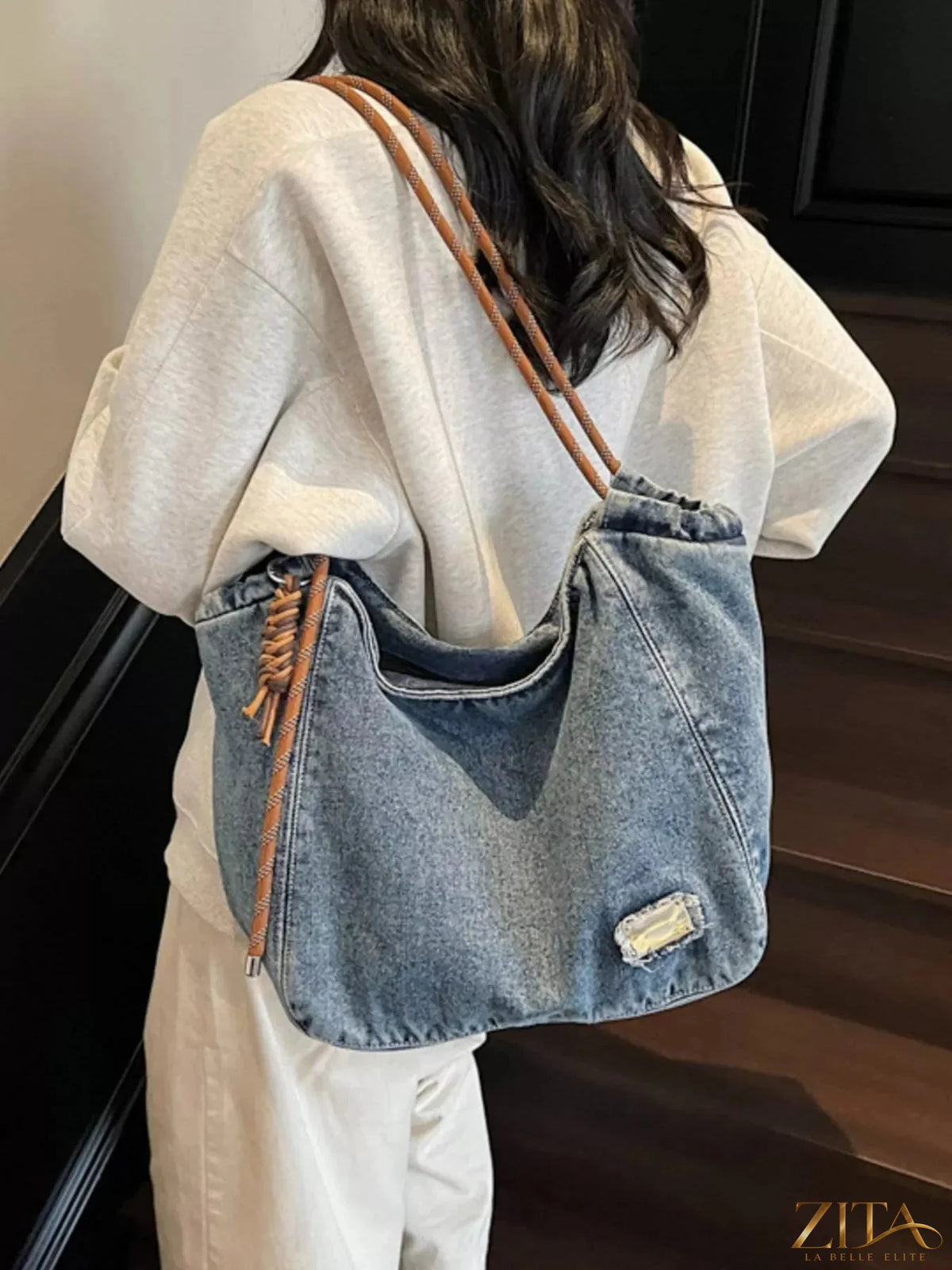 Denim hobo tote bag with rope strap from Zita La Belle Elite, featuring a casual, stylish design and spacious interior.