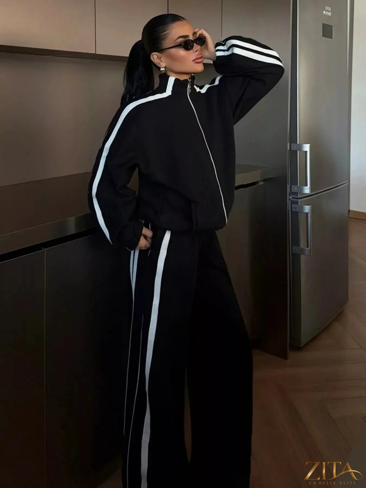 Zita La Belle Elite side stripes zip-up top and matching pants set, black athletic loungewear with white stripe details.
