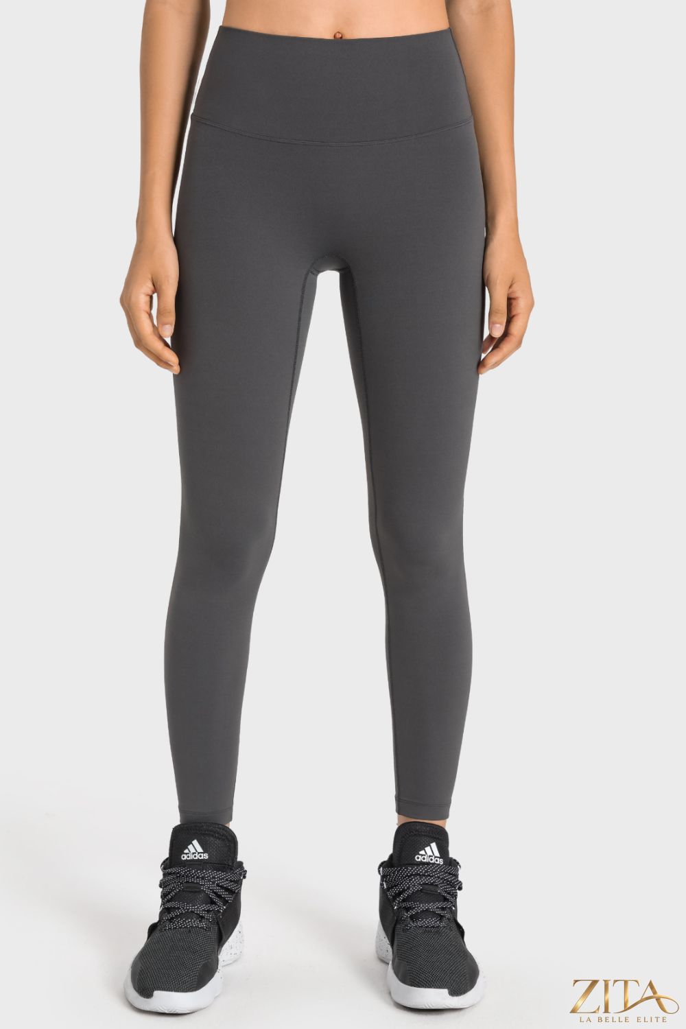Trendsi Millennia high-rise yoga leggings with wide waistband, black stretch fabric, and comfortable fit for active wear.