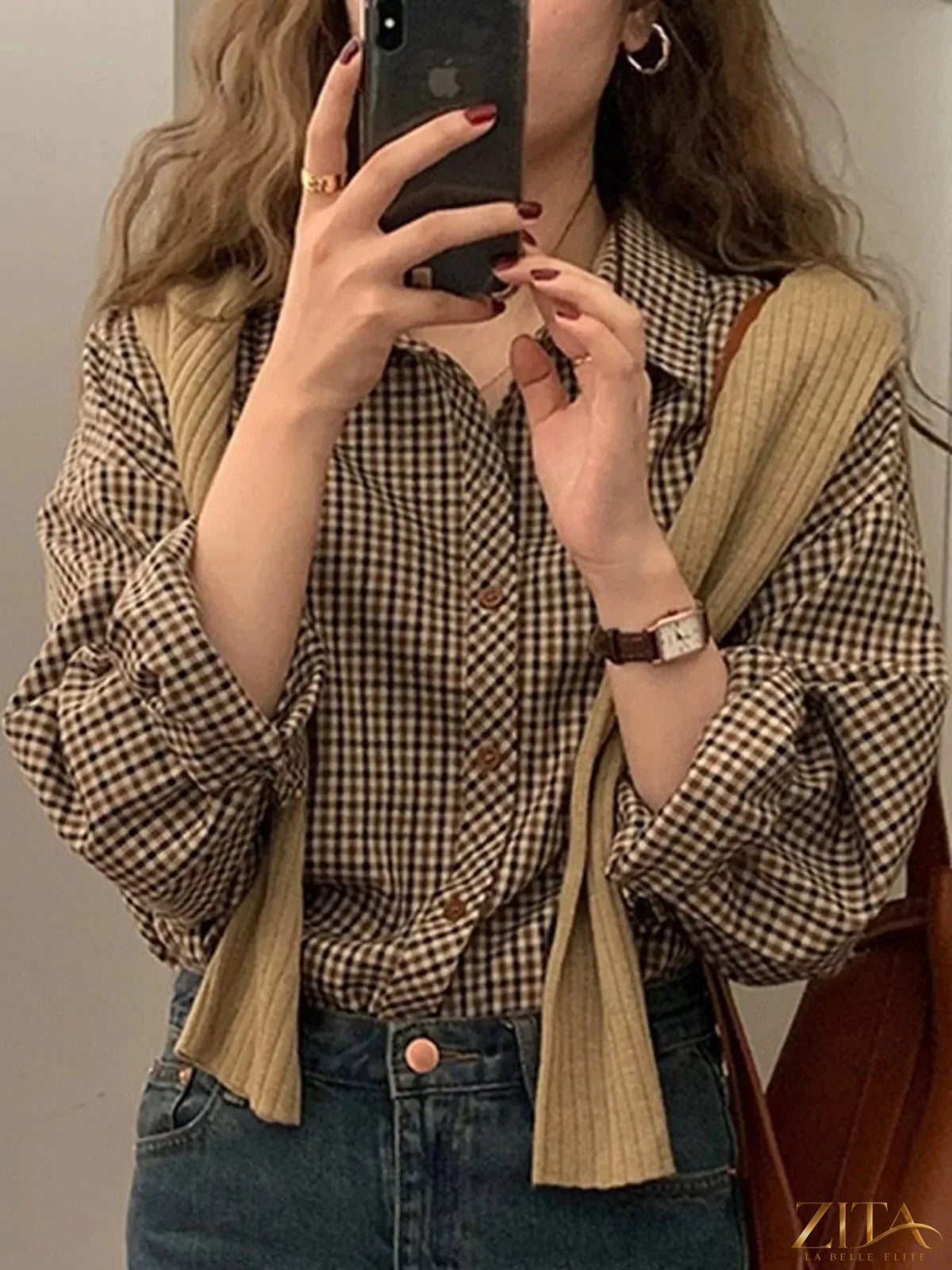 Zita La Belle Elite plaid button-down shirt featuring a classic checkered pattern and collar, displayed on a hanger.
