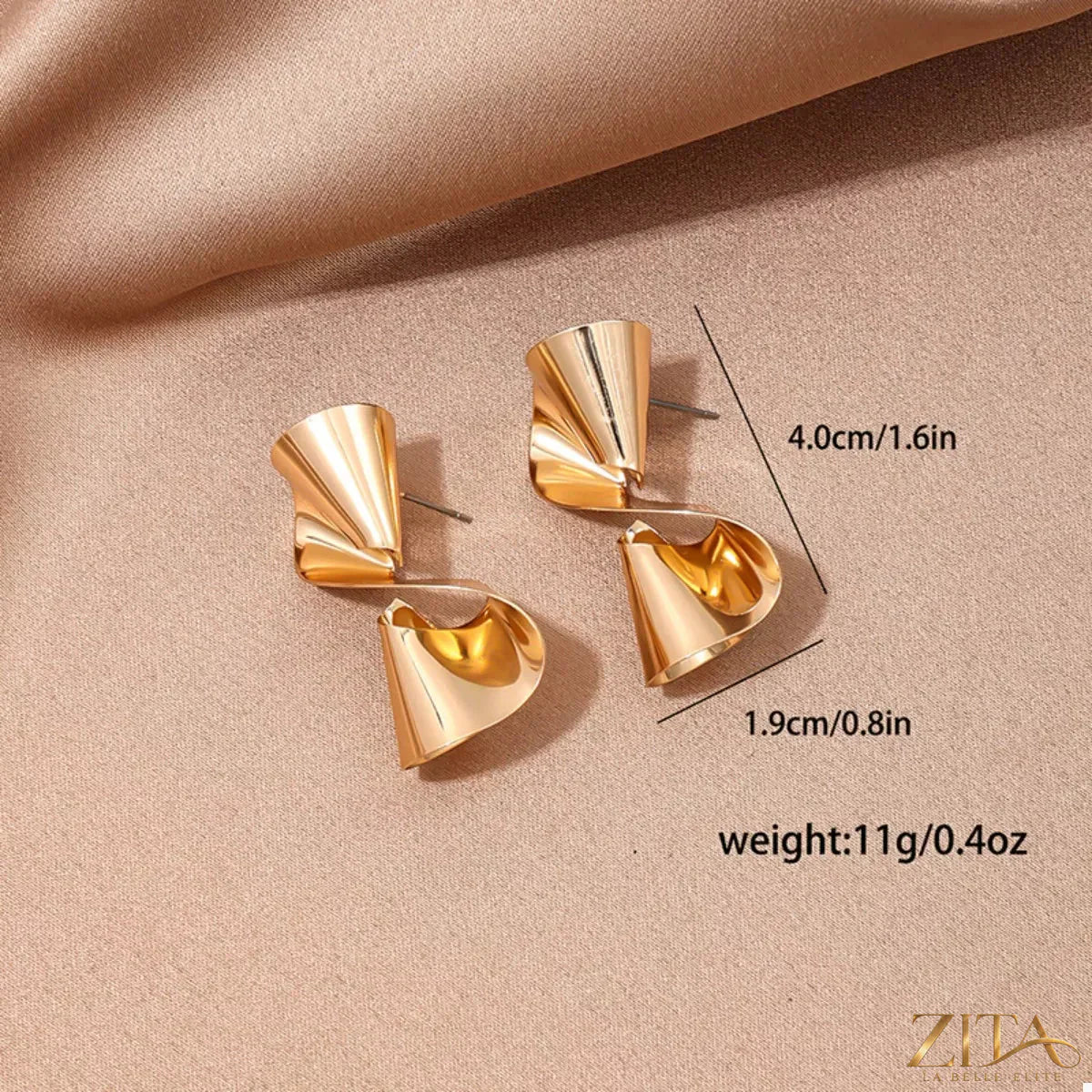 18K gold-plated twist earrings by Zita La Belle Elite, showcasing sleek, spiral-shaped jewelry with a polished finish.