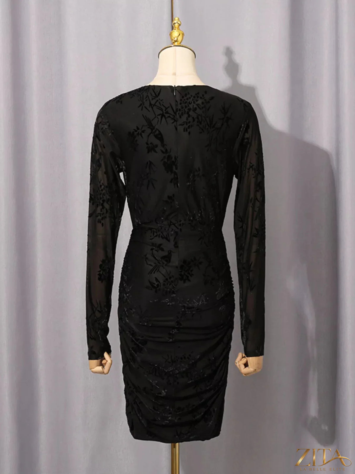 Trendsi ruched long sleeve mini dress in black, featuring a fitted silhouette and stylish design, perfect for casual or dressy occasions.