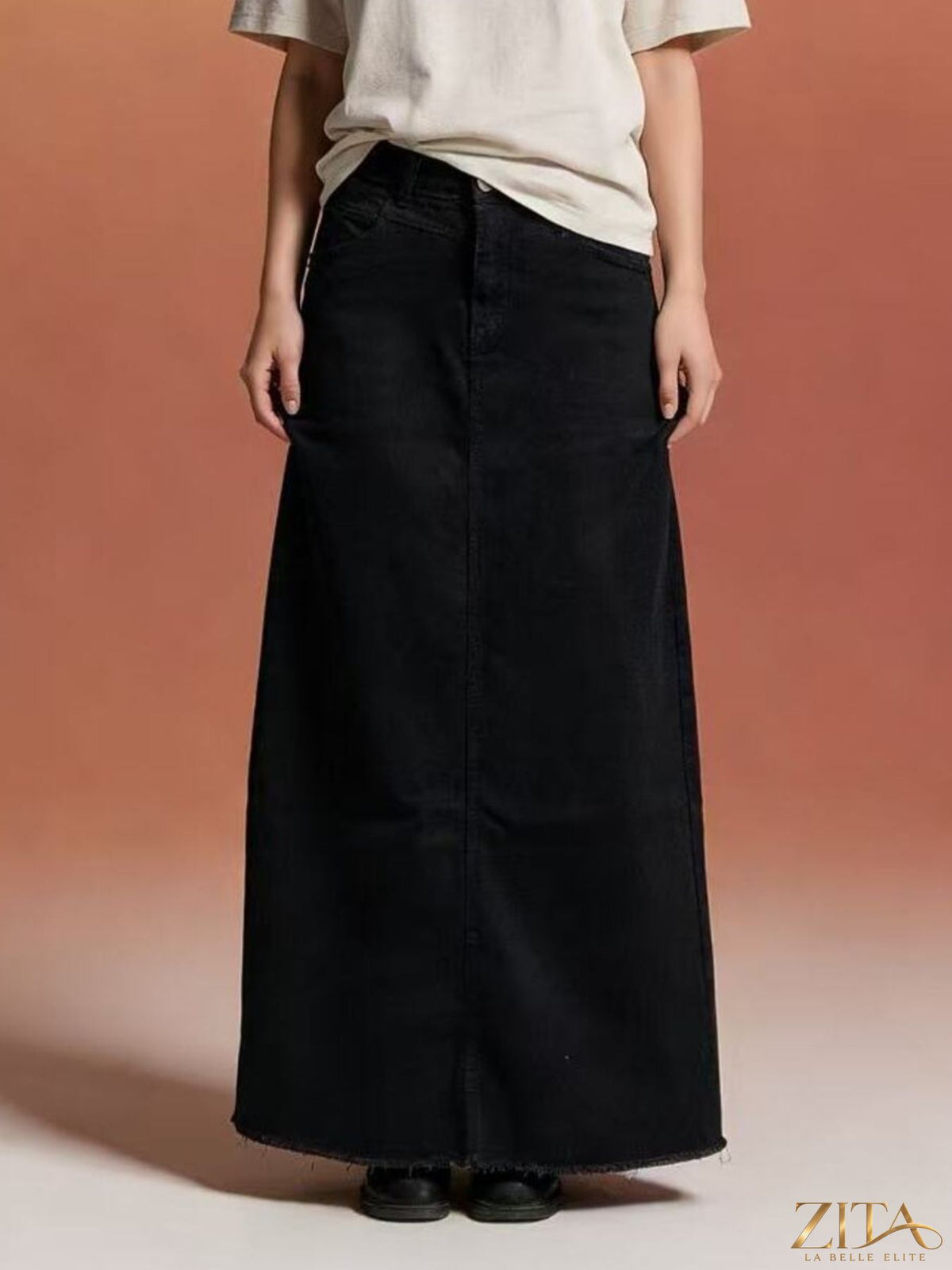 Raw hem maxi denim skirt by Zita La Belle Elite, featuring a flowing silhouette and distressed hem detail.