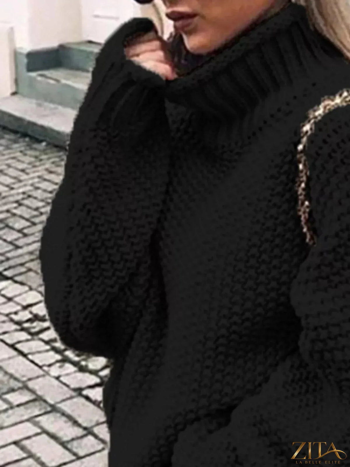Zita La Belle Elite chunky knit turtleneck sweater in cozy beige with thick ribbed collar and textured knit pattern.