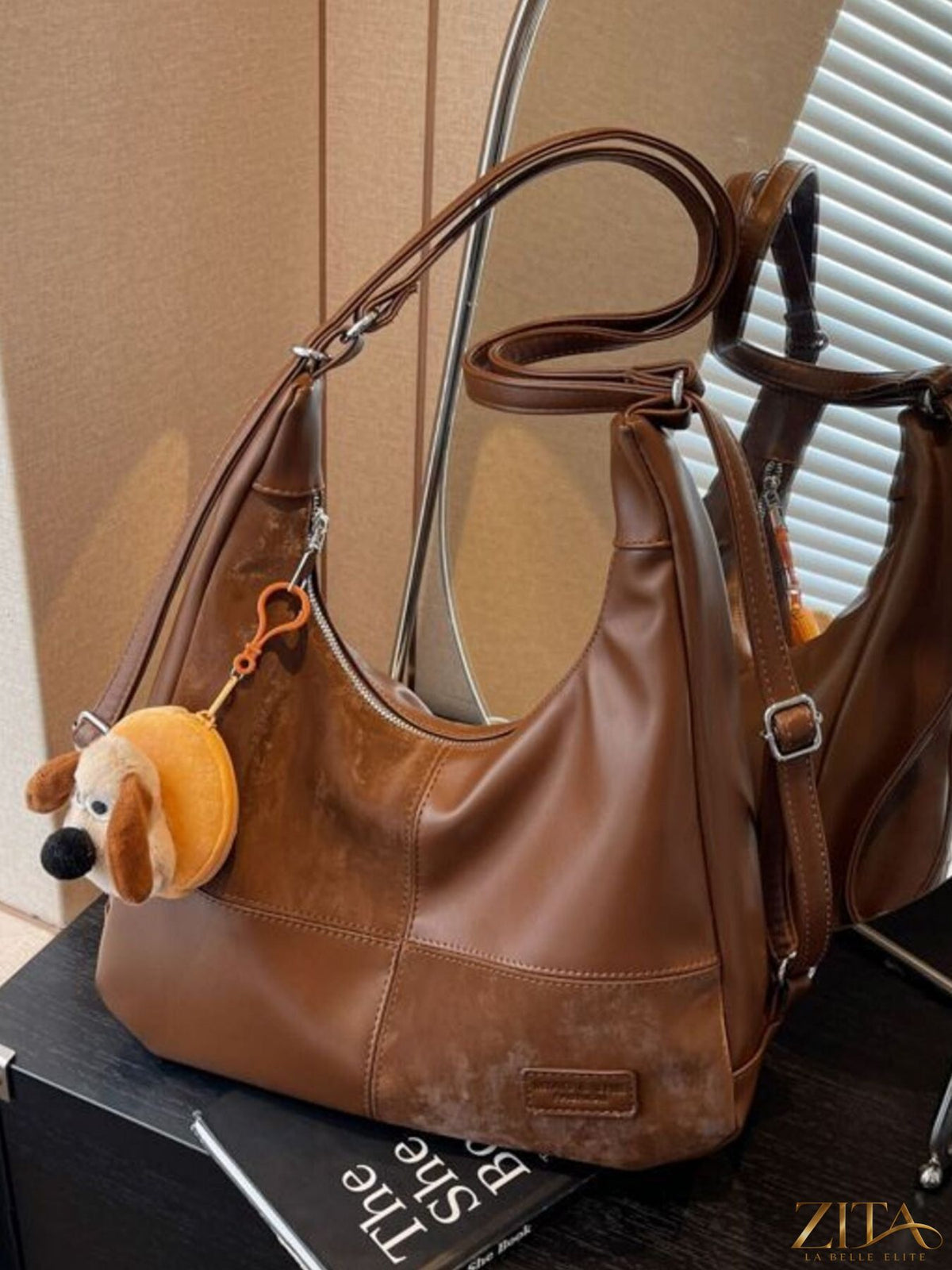 Vintage style hobo shoulder bag by Zita La Belle Elite with leather strap and textured fabric, displayed on a neutral background.