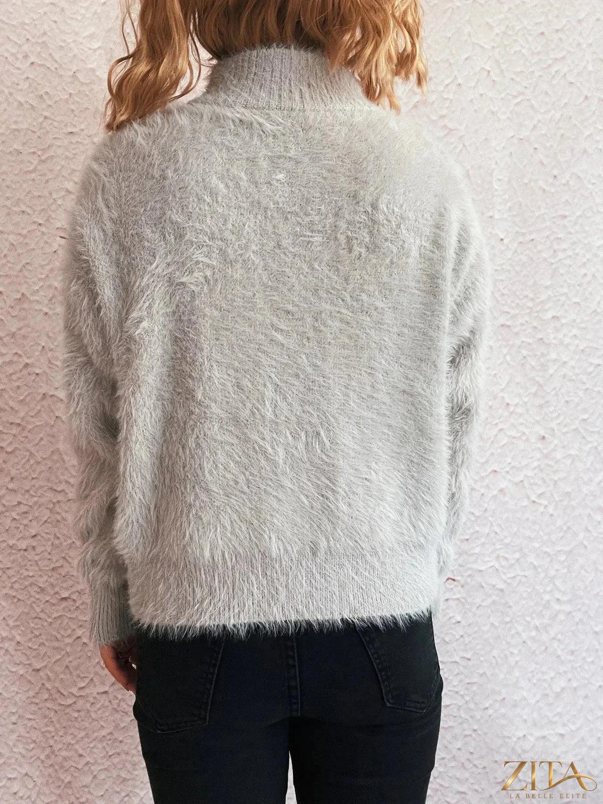 Zita La Belle Elite cozy fuzzy half-zip sweater in soft cream color, featuring a high collar and relaxed fit.