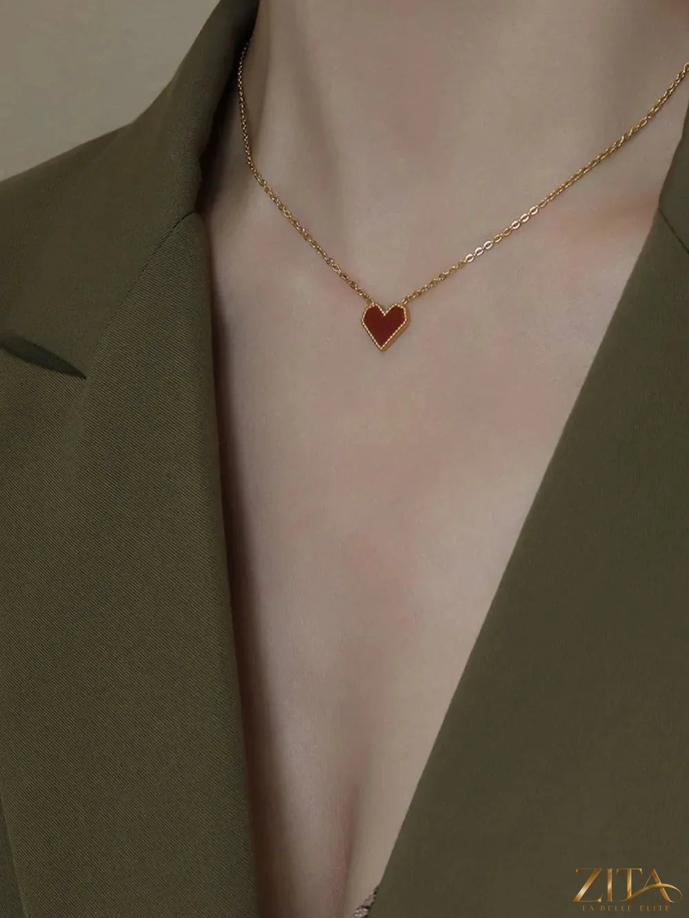 Titanium steel heart necklace by Zita La Belle Elite featuring a sleek, polished heart pendant on a delicate chain.