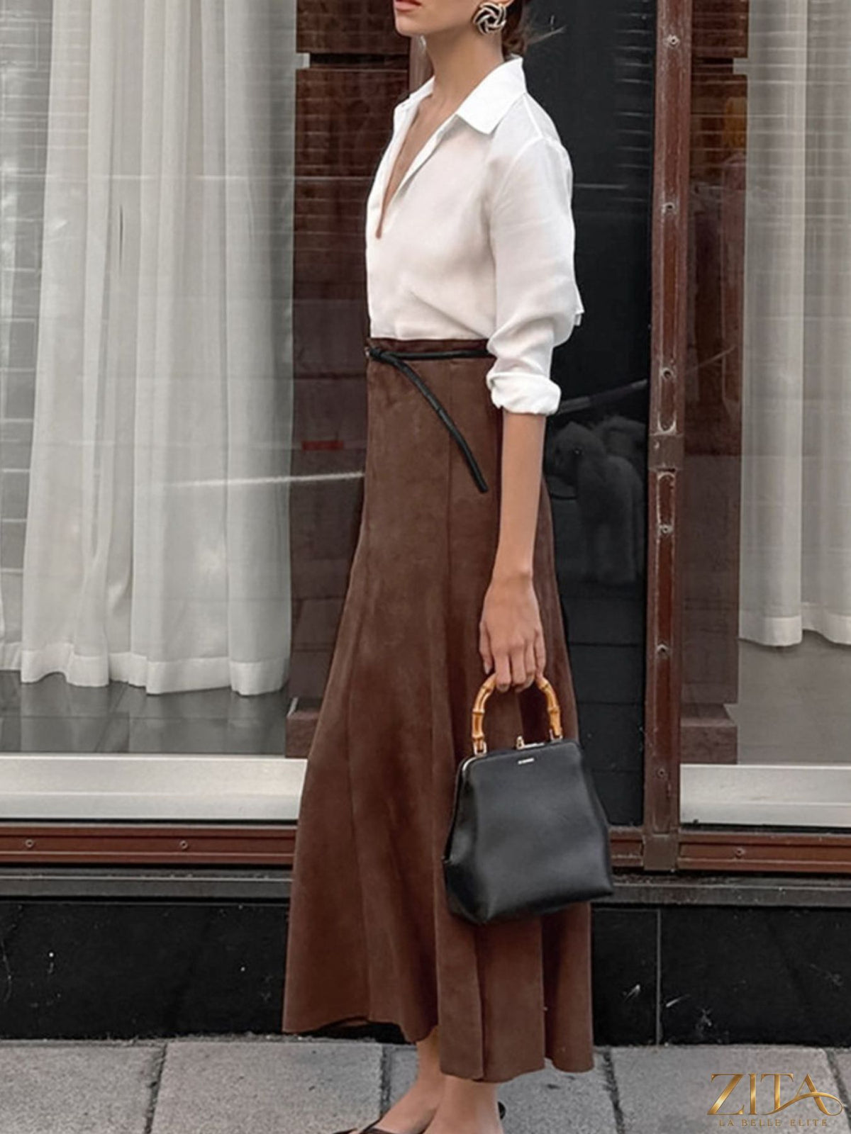 Light brown suede midi skirt by Trendsi, showcasing a smooth, flowing design with a high waist and stylish silhouette.
