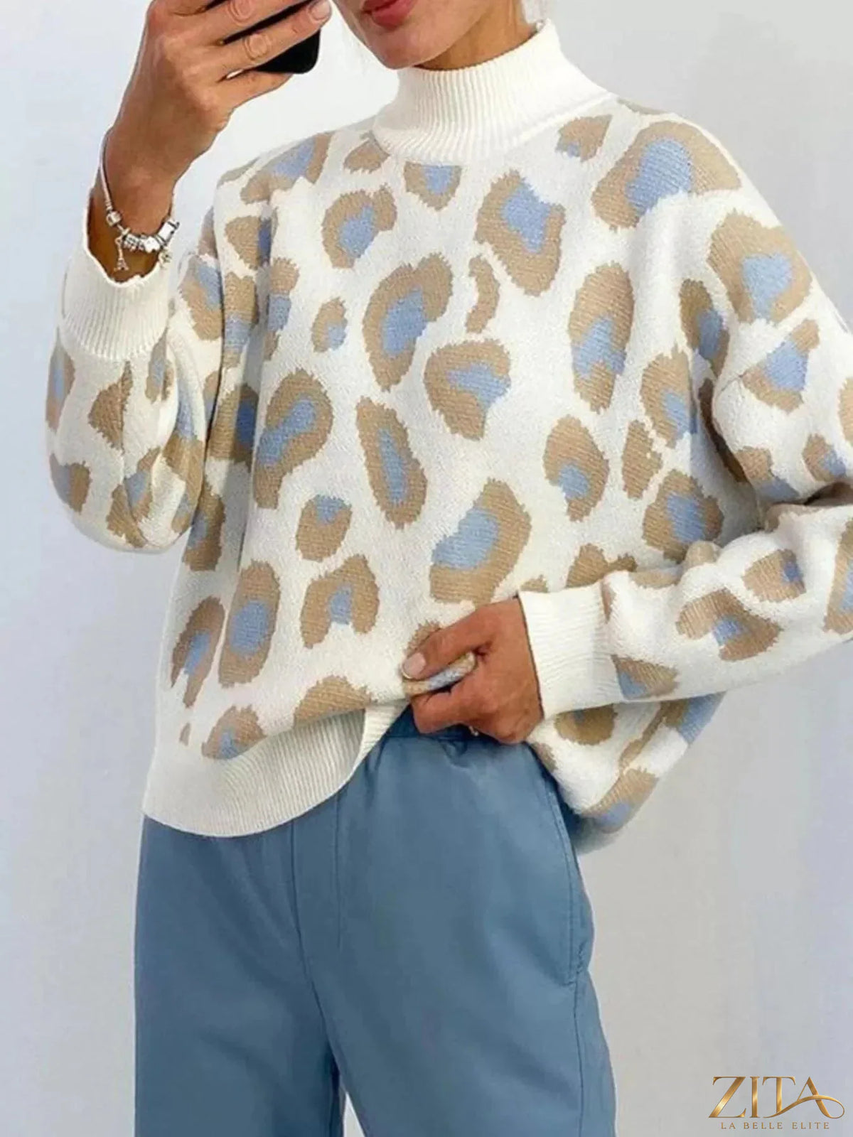 Zita La Belle Elite leopard high neck sweater featuring a bold animal print and cozy knit fabric.