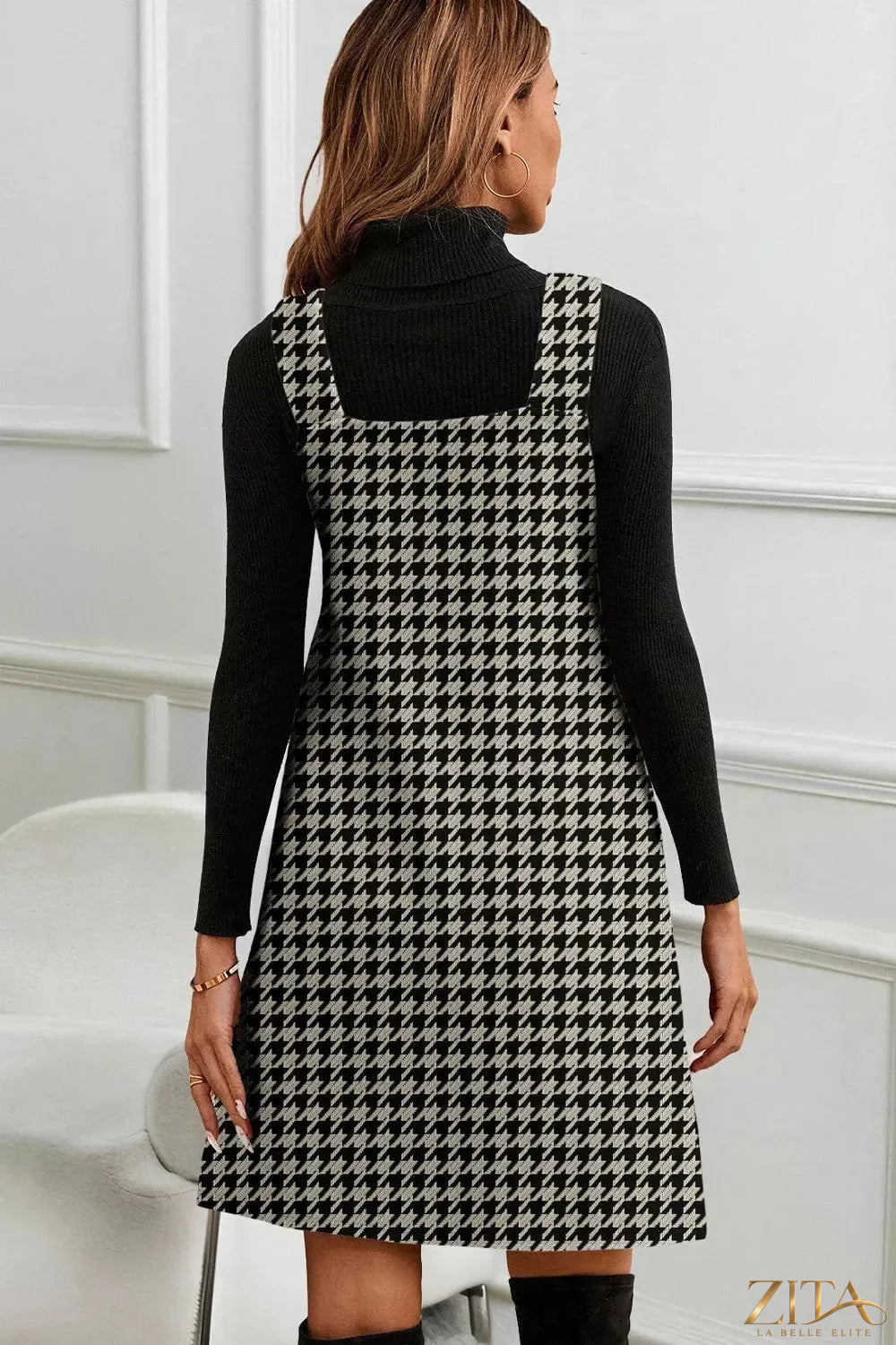 Houndstooth V-neck sleeveless mini dress by Trendsi featuring a stylish black and white pattern and fitted silhouette.