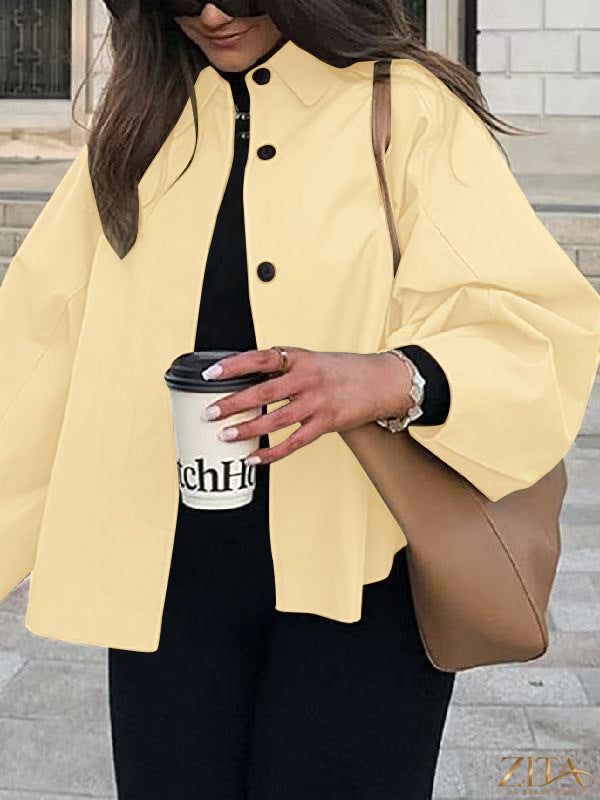 Women's French-style loose mid-length trench coat by Zita La Belle Elite, showcasing classic collar and belted waist in beige fabric.
