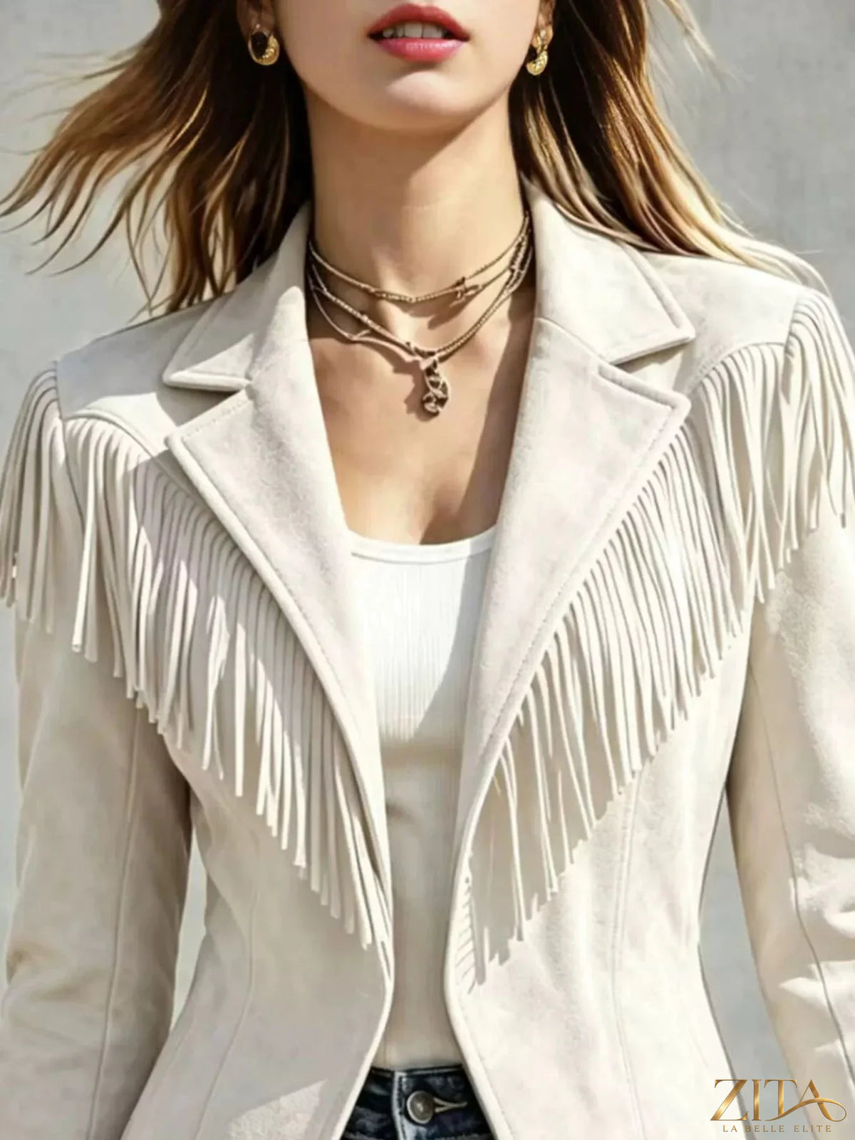 Western-inspired fringed open front jacket by Trendsi, featuring suede-like material with fringe details and a relaxed fit.