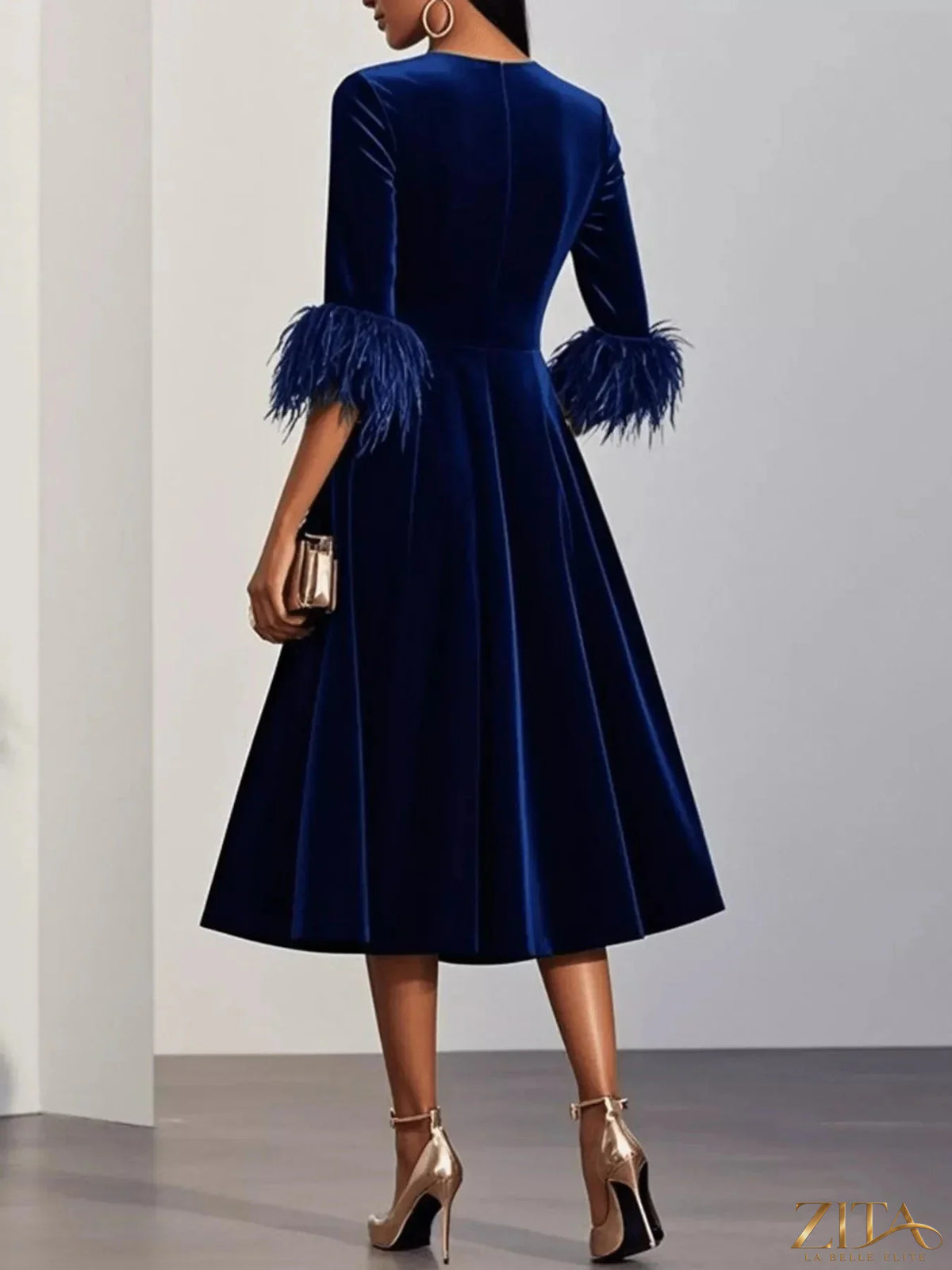 Velvet midi dress by Zita La Belle Elite with feather cuffs, elegant evening dress featuring a fitted silhouette and luxurious fabric.