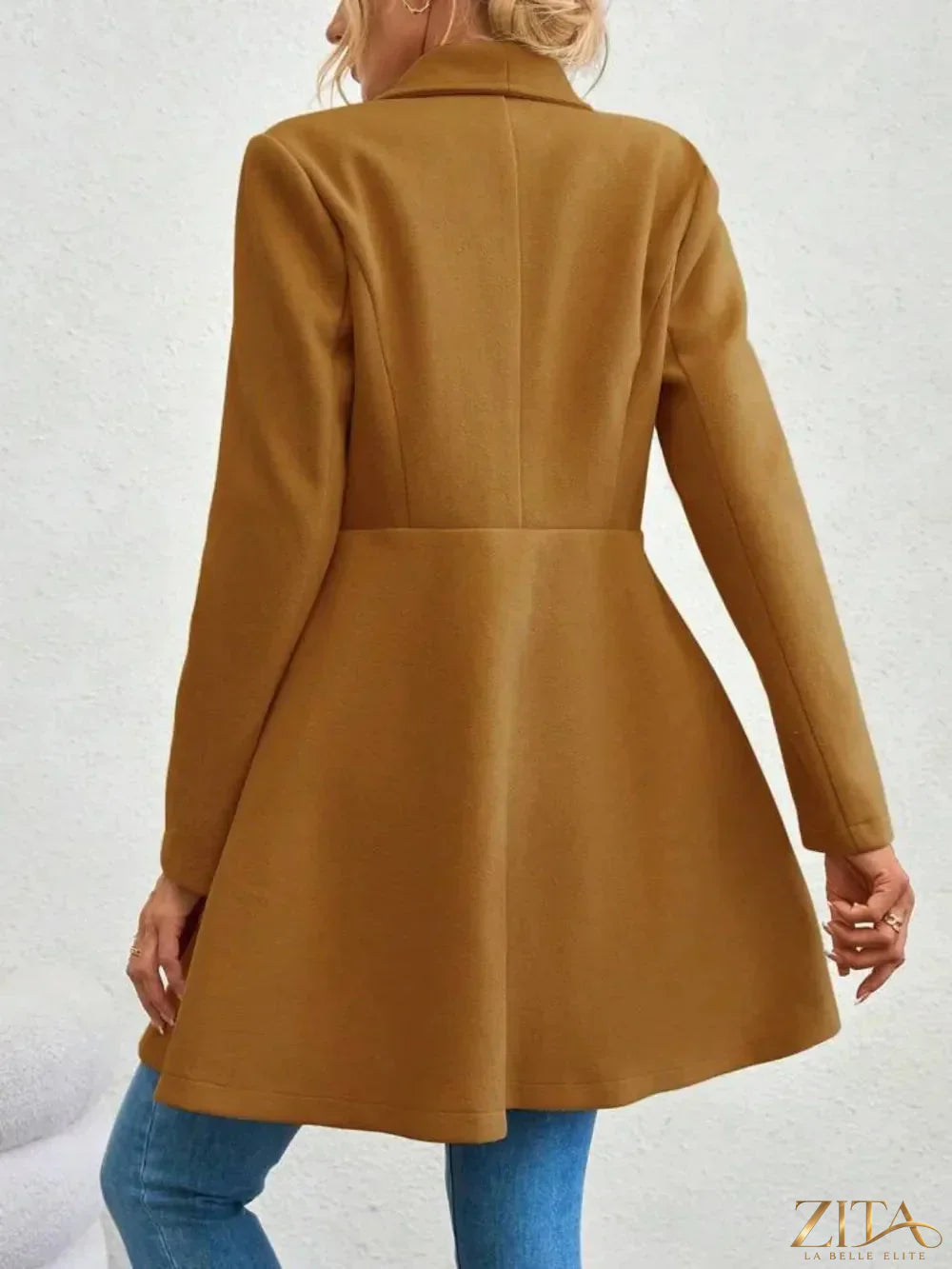 Zita La Belle Elite collared neck button-up long sleeve coat hanging on a wooden hanger, stylish and tailored for women.