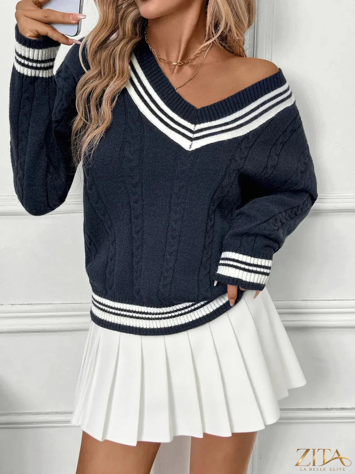 Zita La Belle Elite contrast striped V-neck sweater with bold black and white horizontal stripes, soft knit fabric, and fitted design.