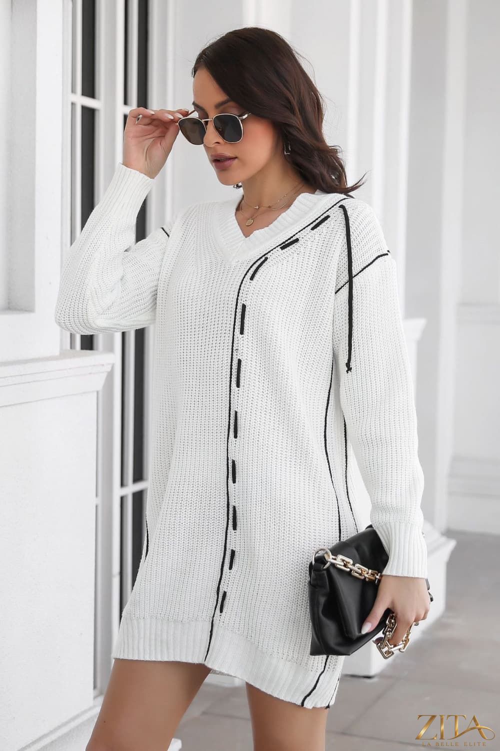 Black contrast V-neck sweater dress from Trendsi, featuring long sleeves and a fitted silhouette.