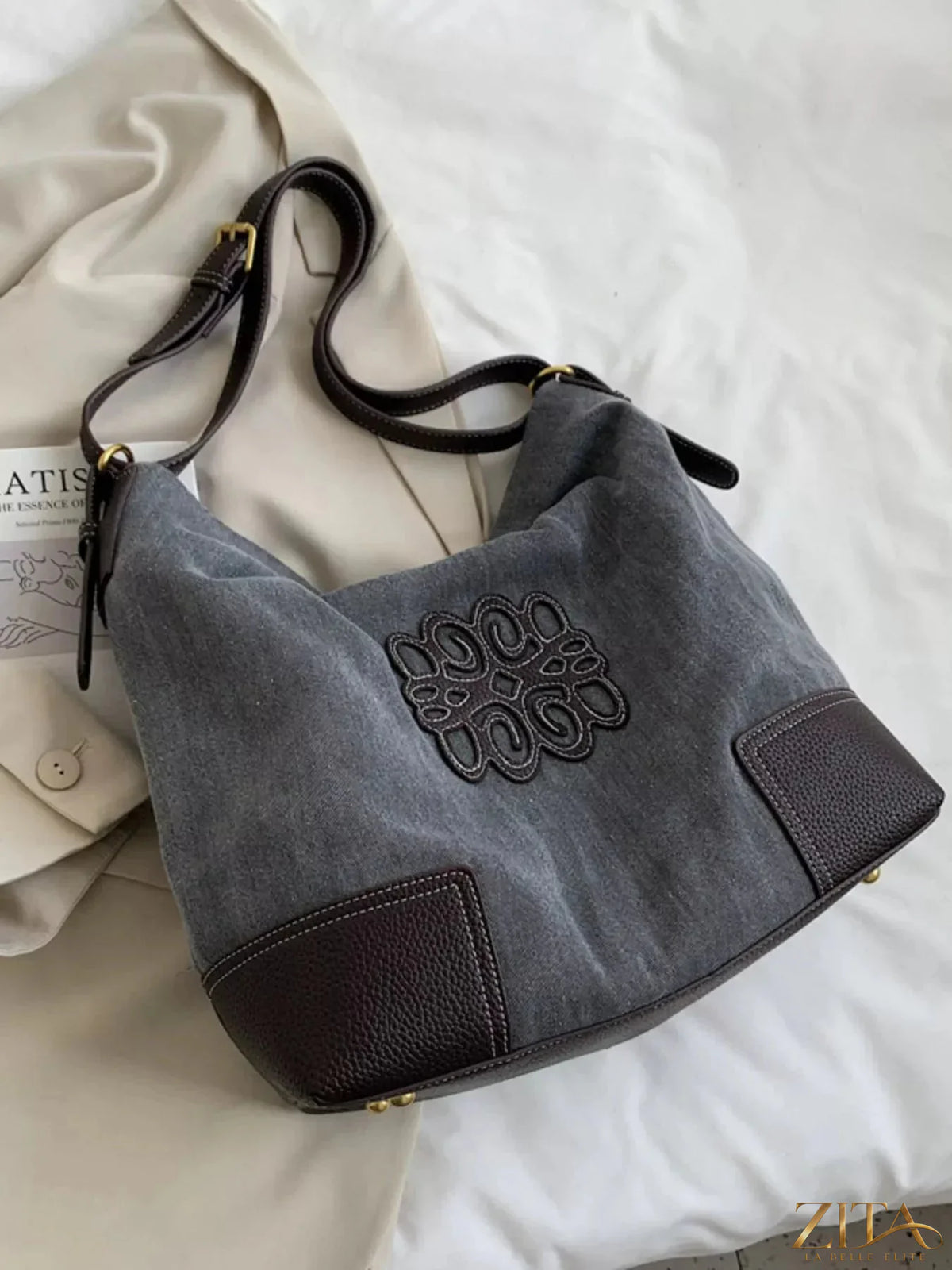 Embroidered canvas tote bag by Zita La Belle Elite with colorful floral embroidery and sturdy handles.