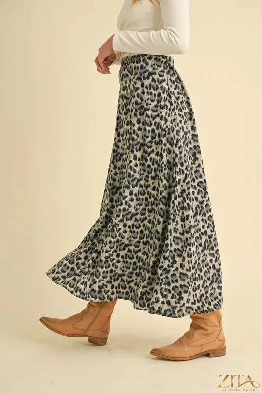 Aemi+Co leopard print midi skirt from Trendsi, featuring a flowing silhouette and bold animal print fabric.