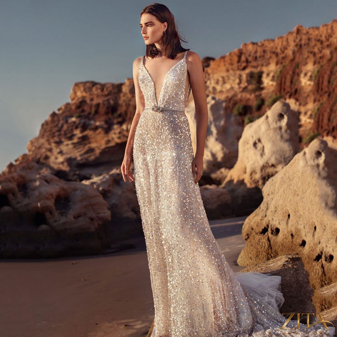 Silver sequin V-neck sleeveless camisole gown by Zita La Belle Elite, featuring elegant sequin embellishments and a flowing silhouette.