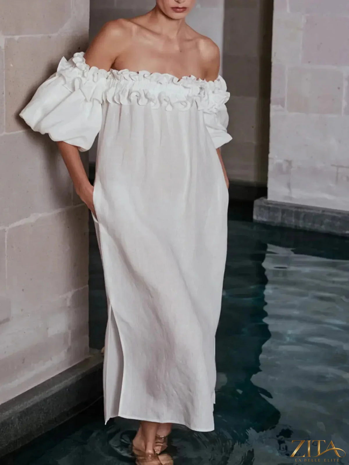 Zita La Belle Elite side slit off-shoulder dress in flowing fabric, featuring a stylish off-shoulder design and high slit.