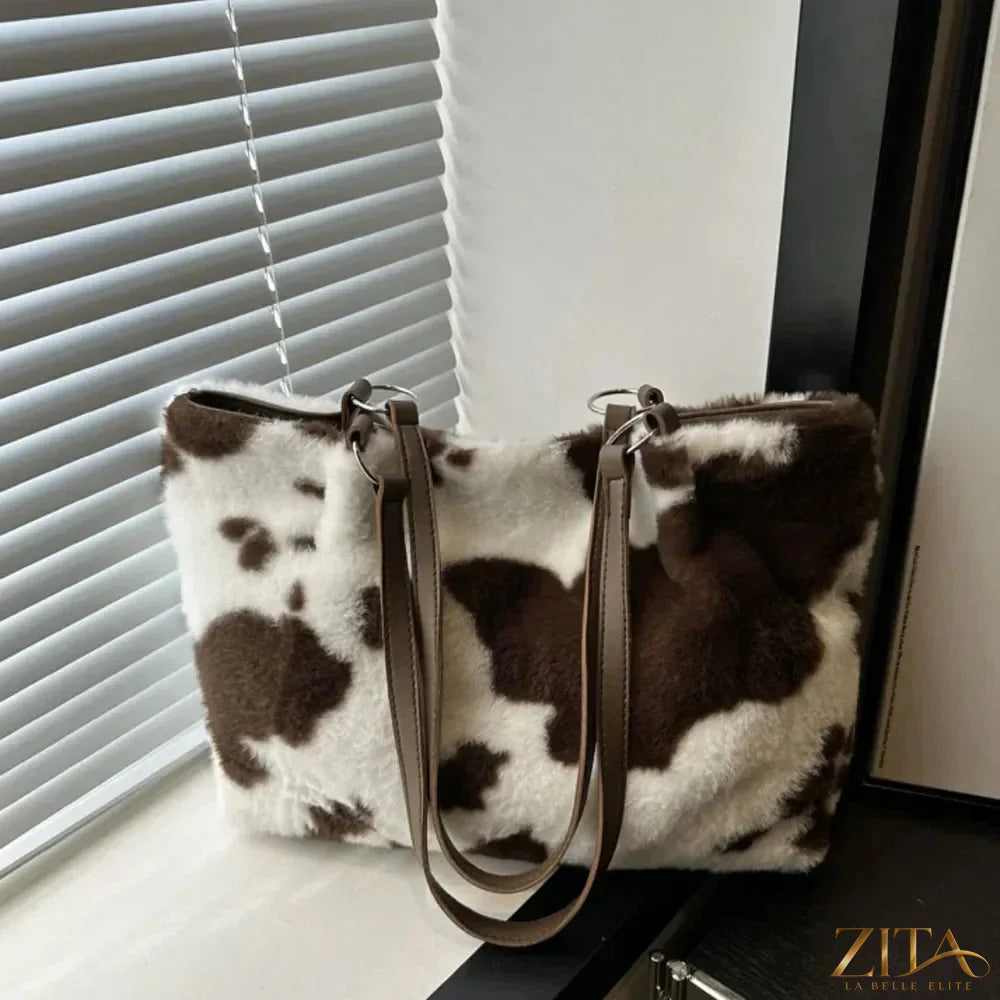Cow print furry tote bag by Zita La Belle Elite with plush texture and spacious design, perfect for everyday use.