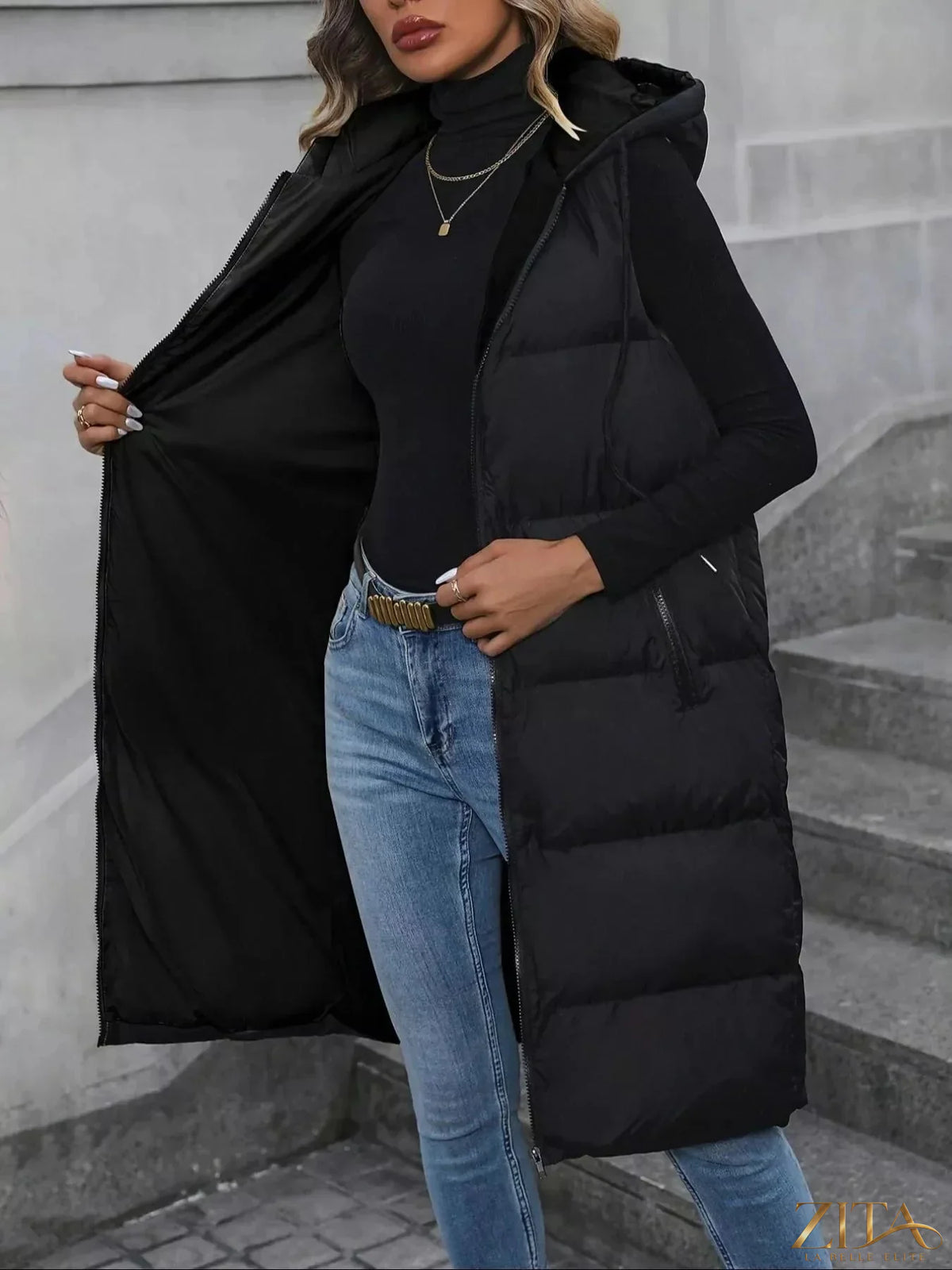 Longline padded hooded vest coat by Zita La Belle Elite, shown with quilted fabric, adjustable hood, and sleek winter style.