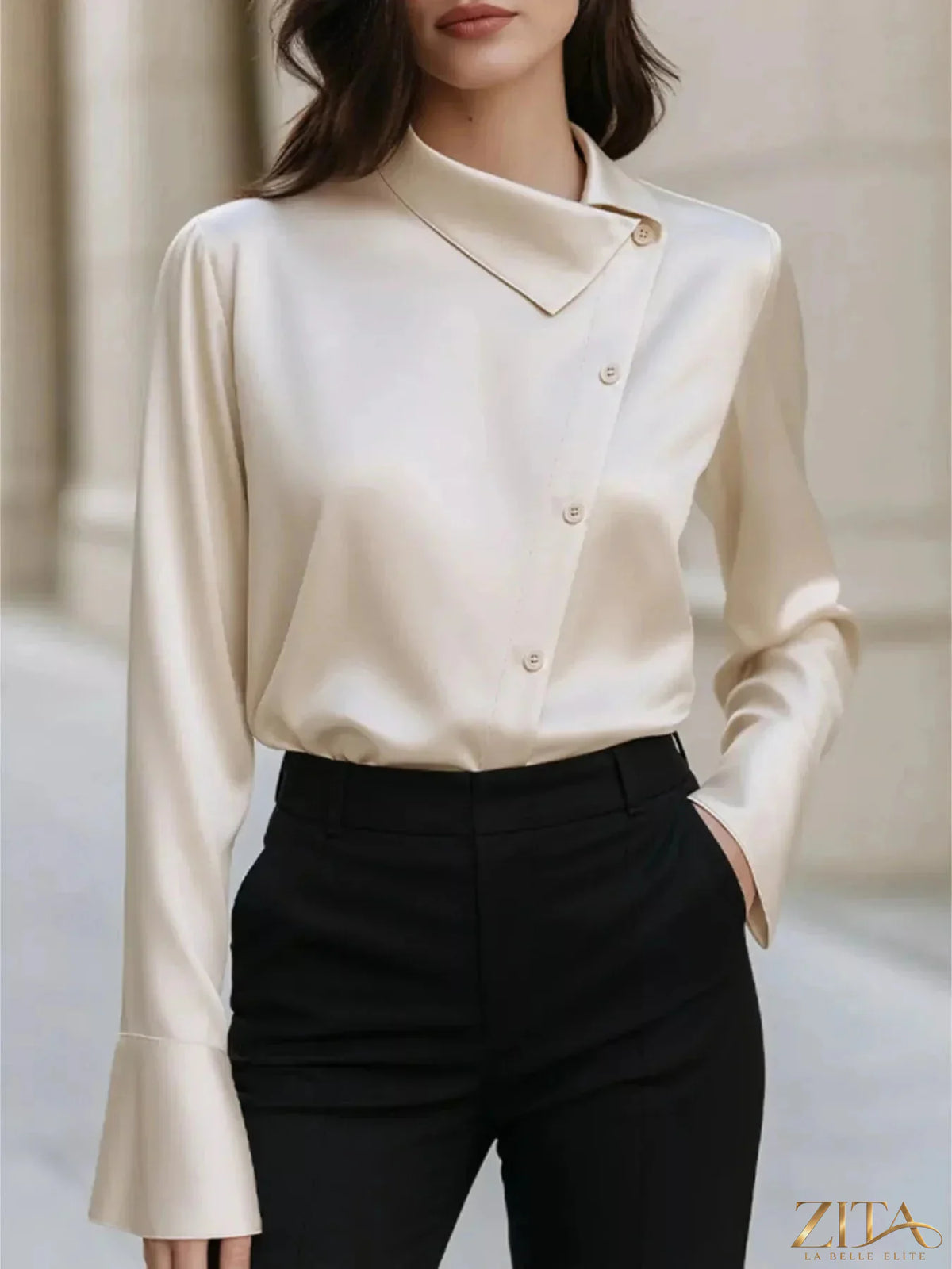 Zita La Belle Elite asymmetric satin blouse with a stylish collar, showcasing elegant fabric and modern design.